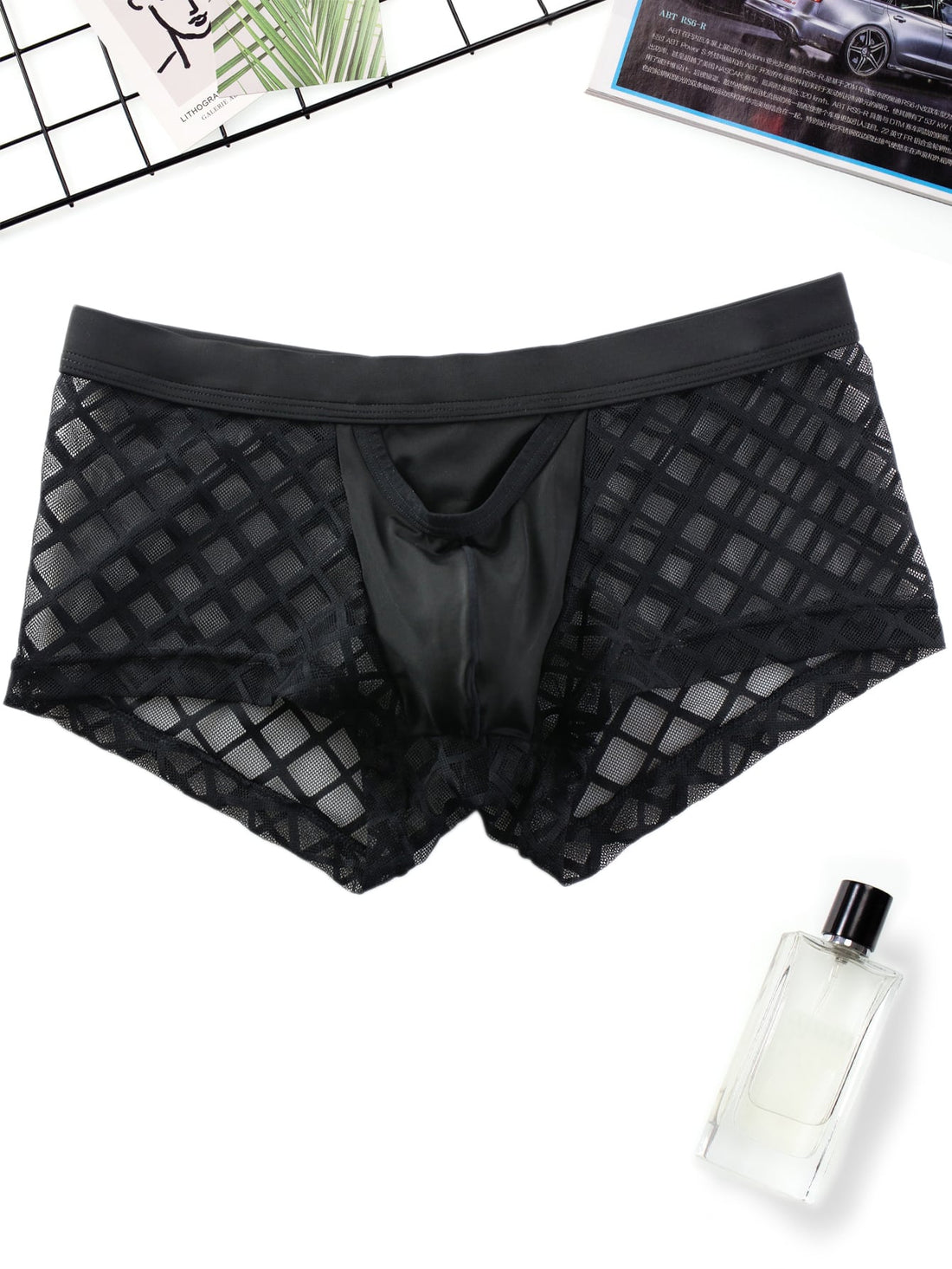 Men's black low-rise plaid mesh panel boxer brief with semi-sheer fabric and high-stretch fit