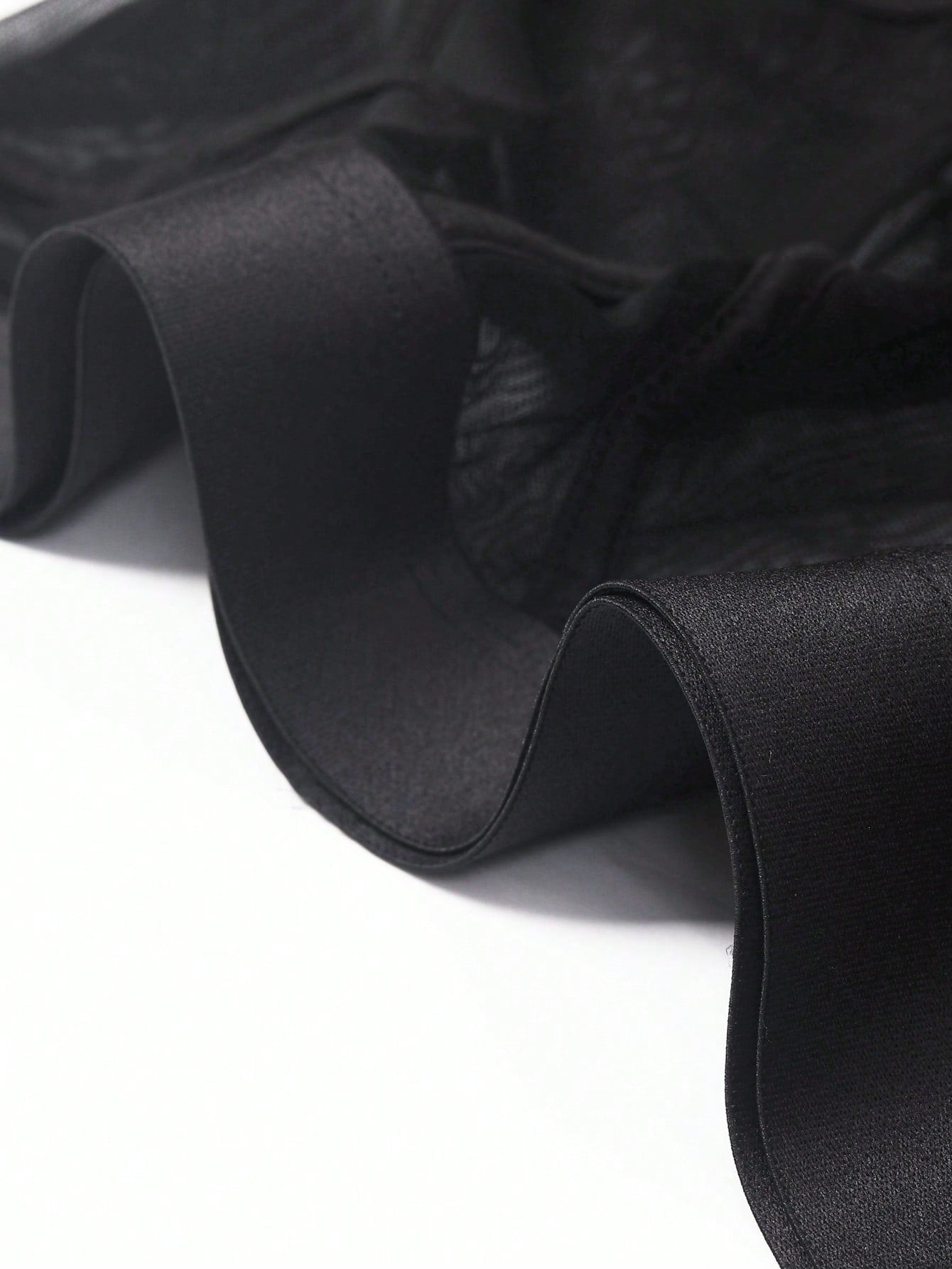 Men's black mid-rise sheer contrast mesh underwear with plain design and medium stretch fabric