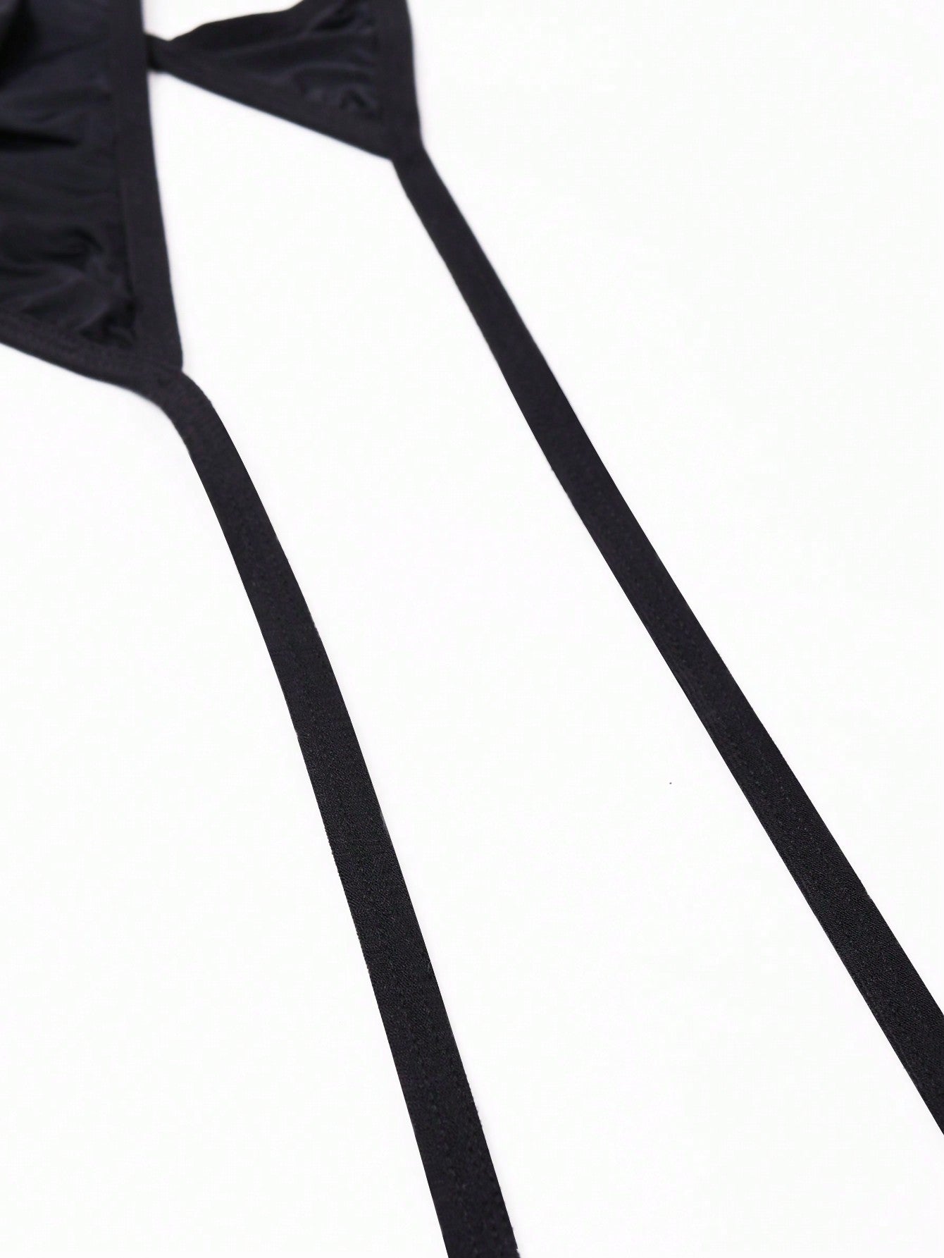 Men's plain black knitted thong underwear with knot detail and low-rise design