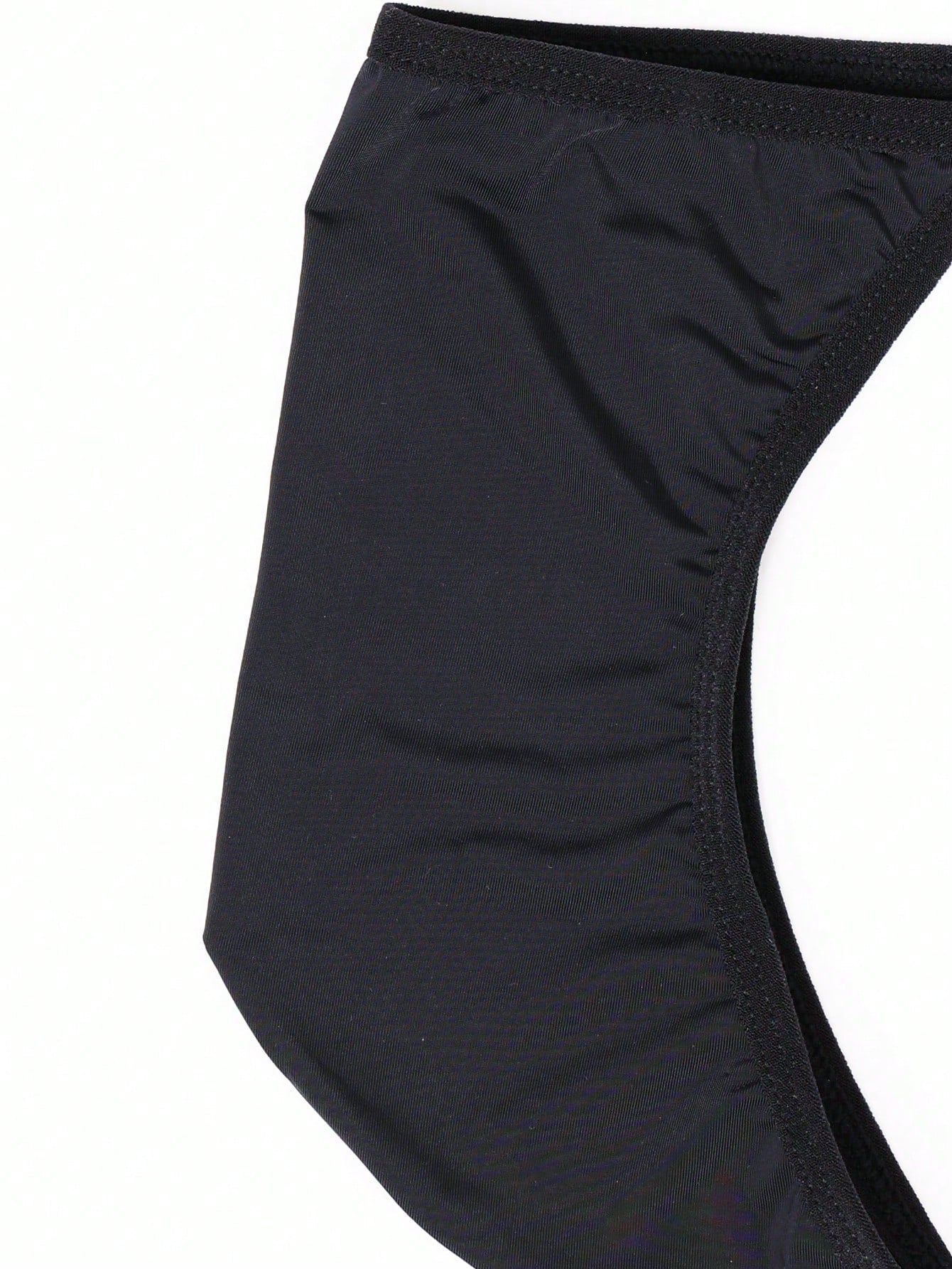 Men's plain black knitted thong underwear with knot detail and low-rise design