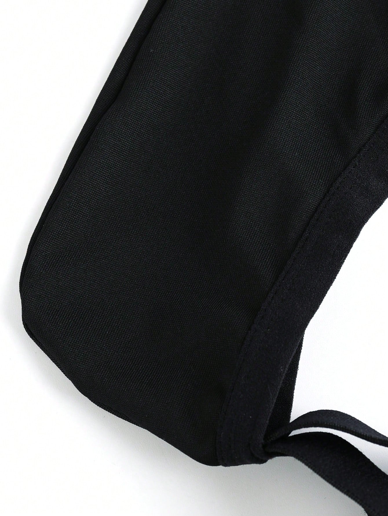 Men's low rise jockstrap underwear with cut out detail and colorblock design in medium-stretch knitted fabric