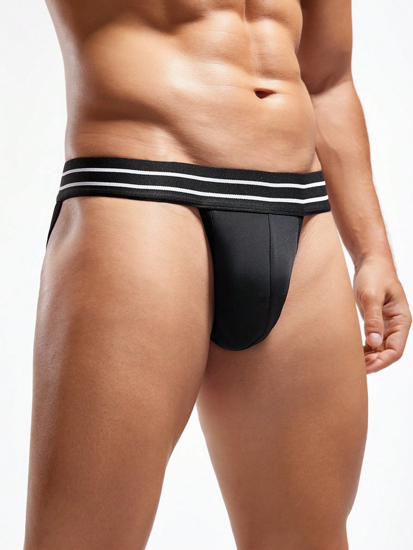 Men's black colorblock low rise briefs with striped pattern, contrast mesh, and tape details