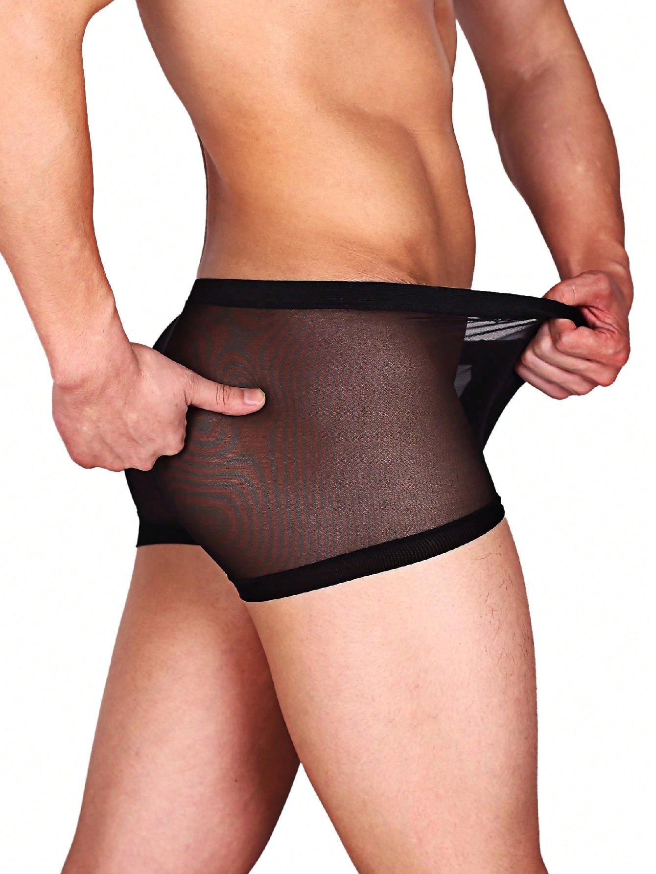 Men's black semi-sheer mesh low-rise trunks with contrast binding and high-stretch fabric