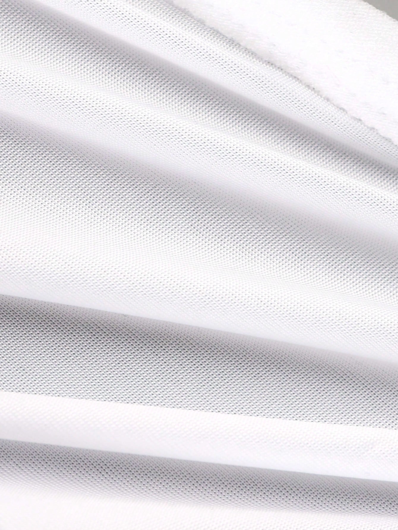 Men's white plain daily G-string underwear with tape detail, mid-rise fit, and minimal jockstrap-style design