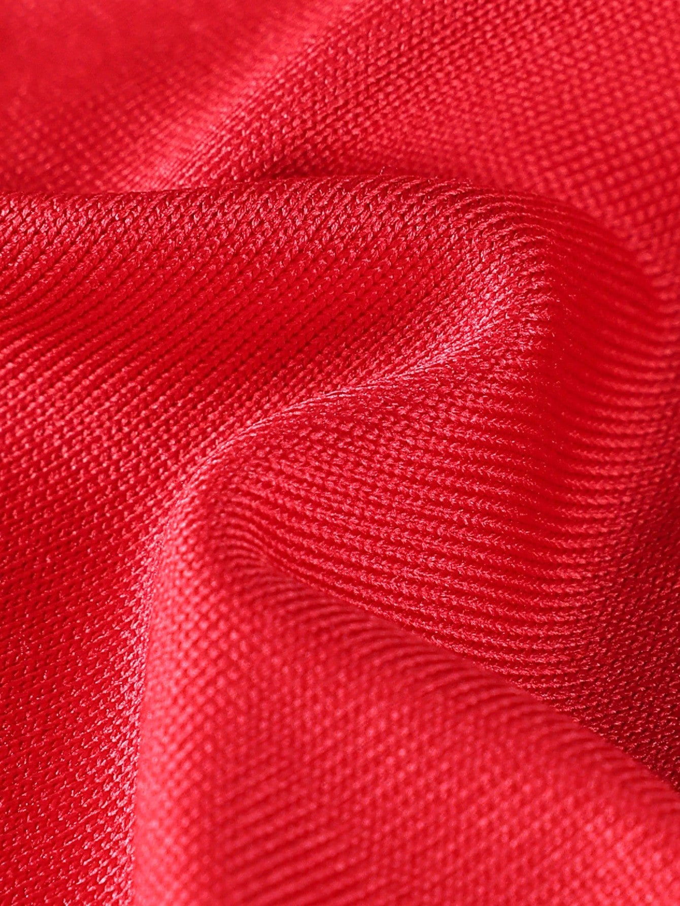 Men's red low-rise thong with lace panel, cut-out detail, and colorblock design