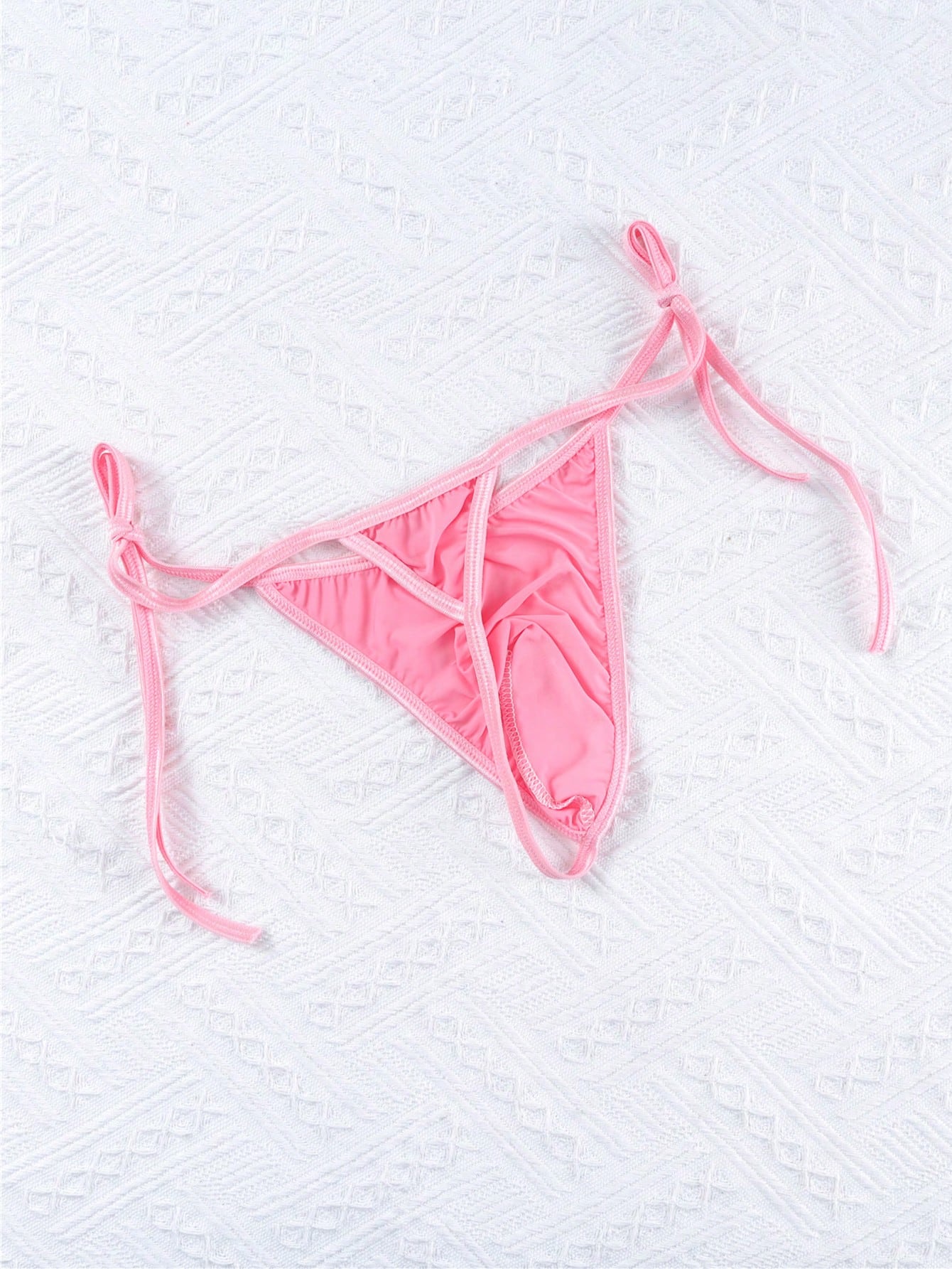 Men's low-rise semi-sheer thong underwear with adjustable lace-up sides and a plain high-stretch knitted fabric design.