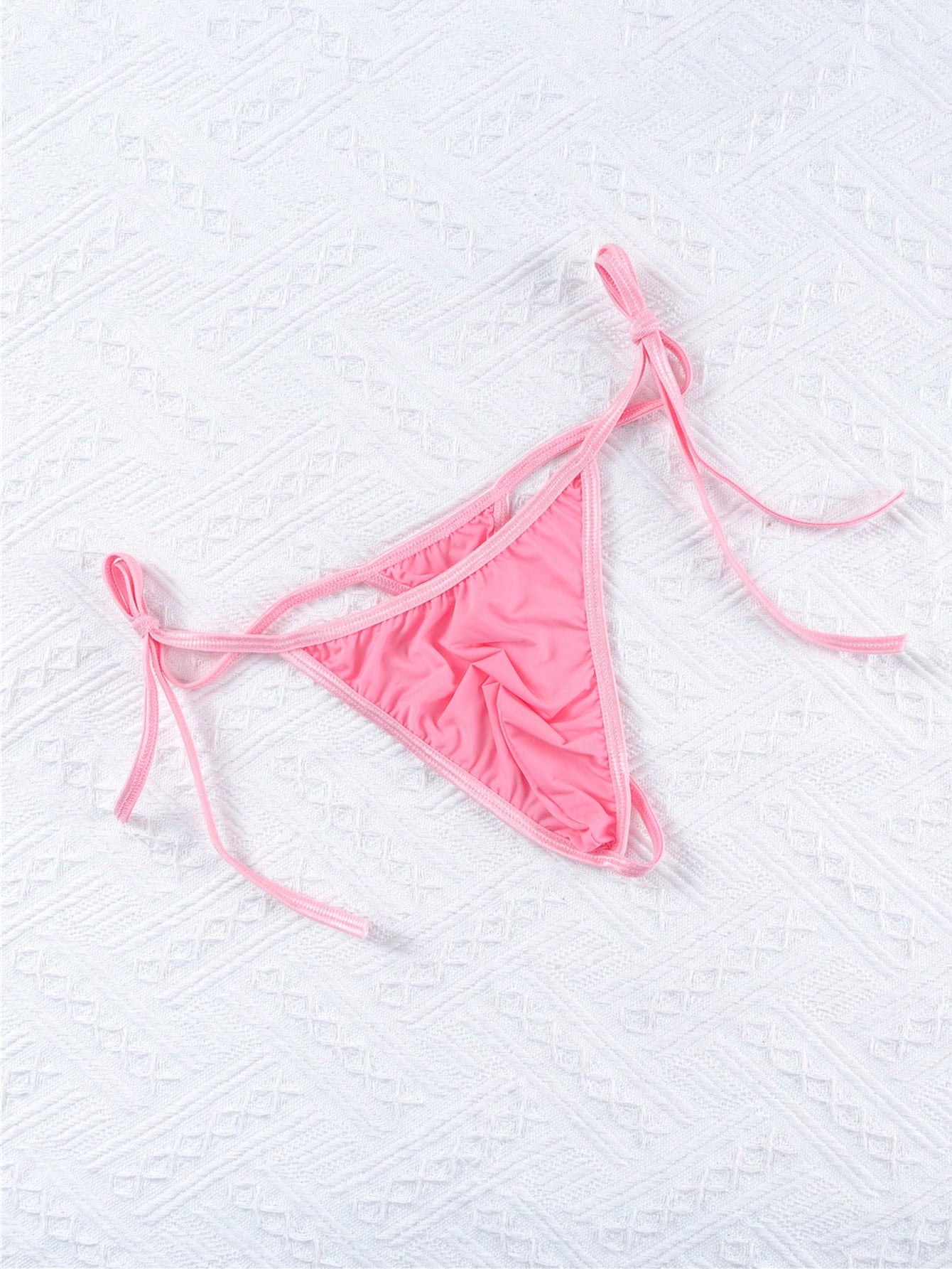 Men's low-rise semi-sheer thong underwear with adjustable lace-up sides and a plain high-stretch knitted fabric design.