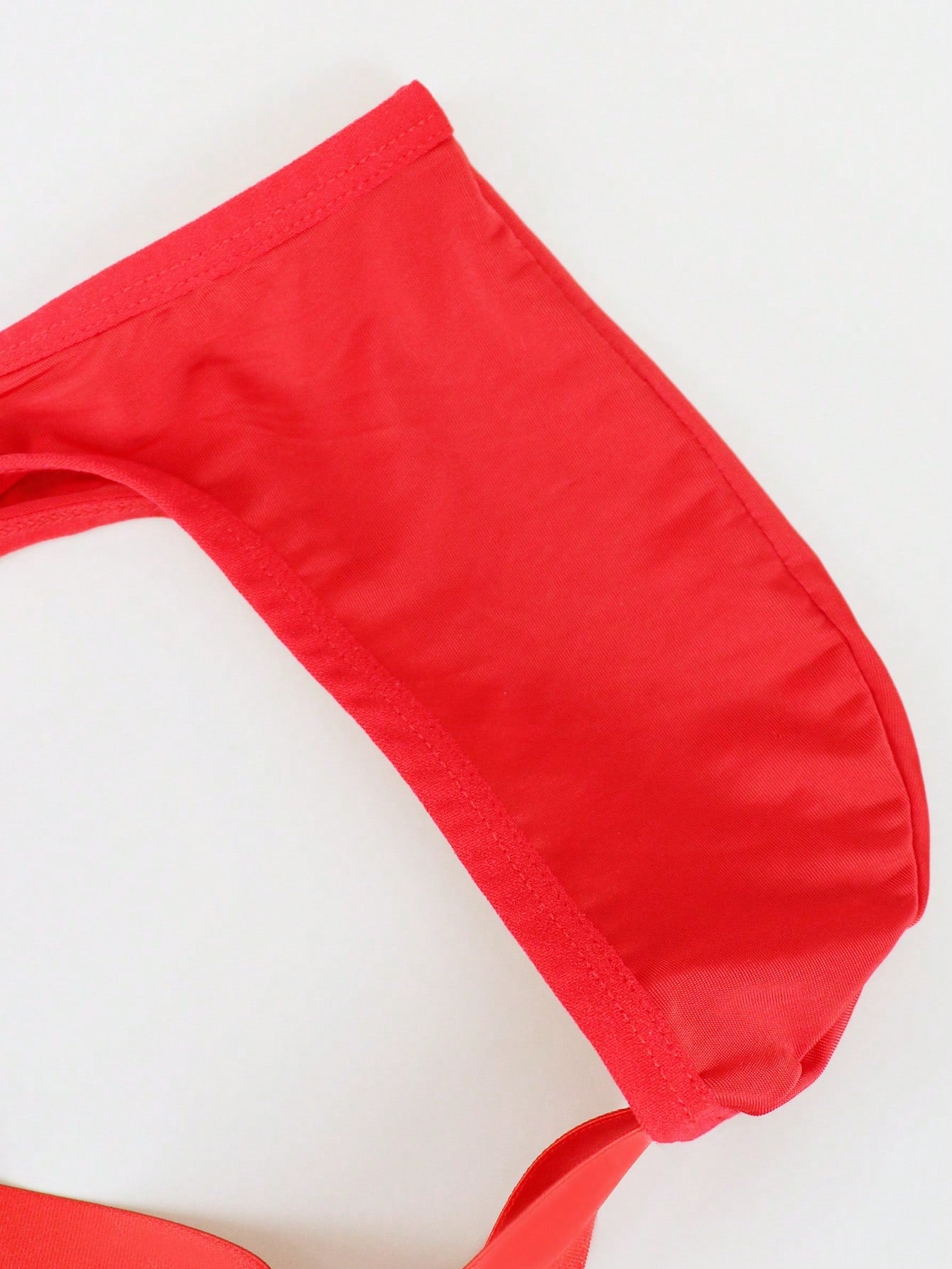 Men's solid color hollow breathable jockstrap underwear with a low-rise brief-style front and minimalist design
