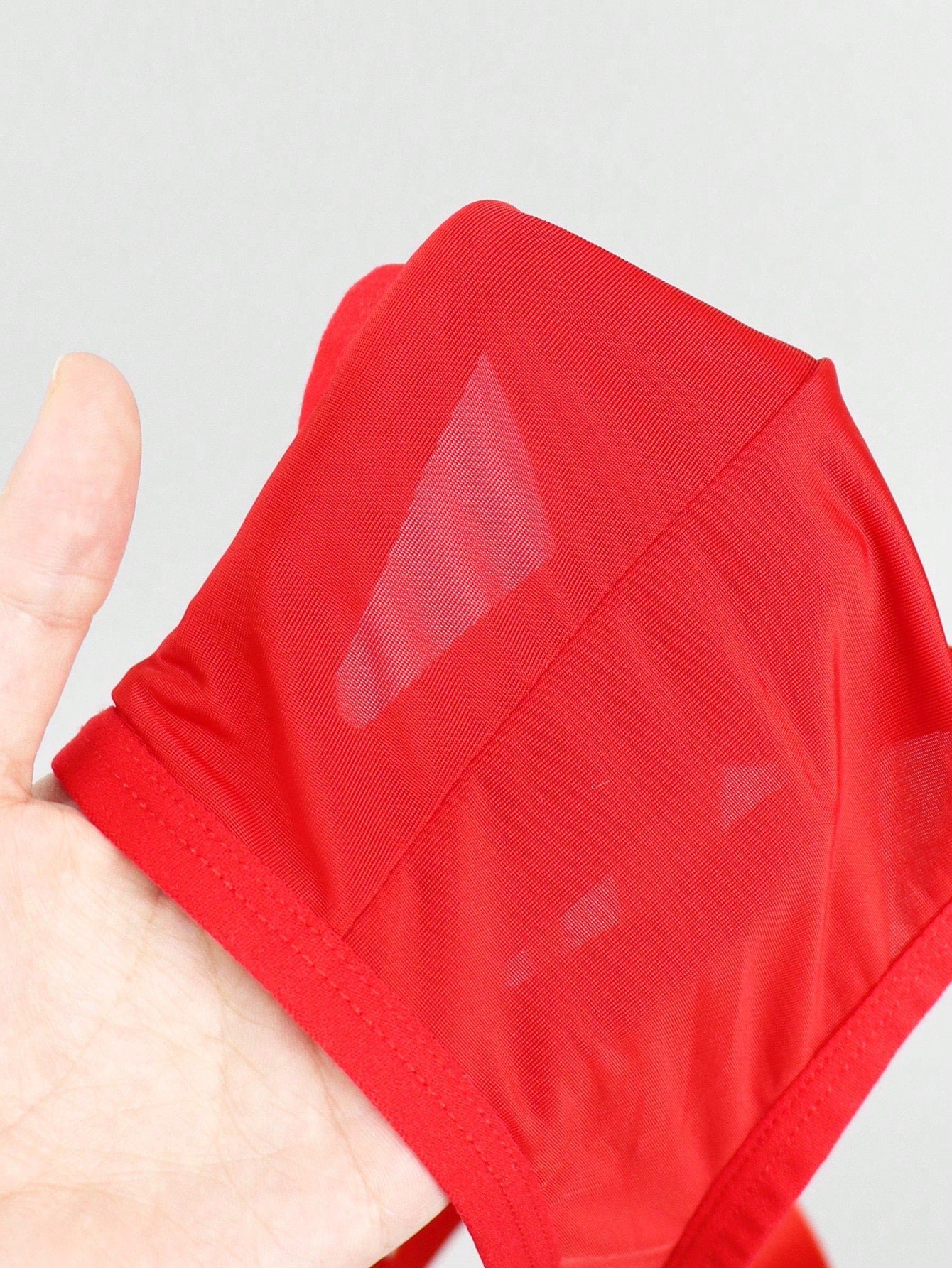 Men's solid color hollow breathable jockstrap underwear with a low-rise brief-style front and minimalist design