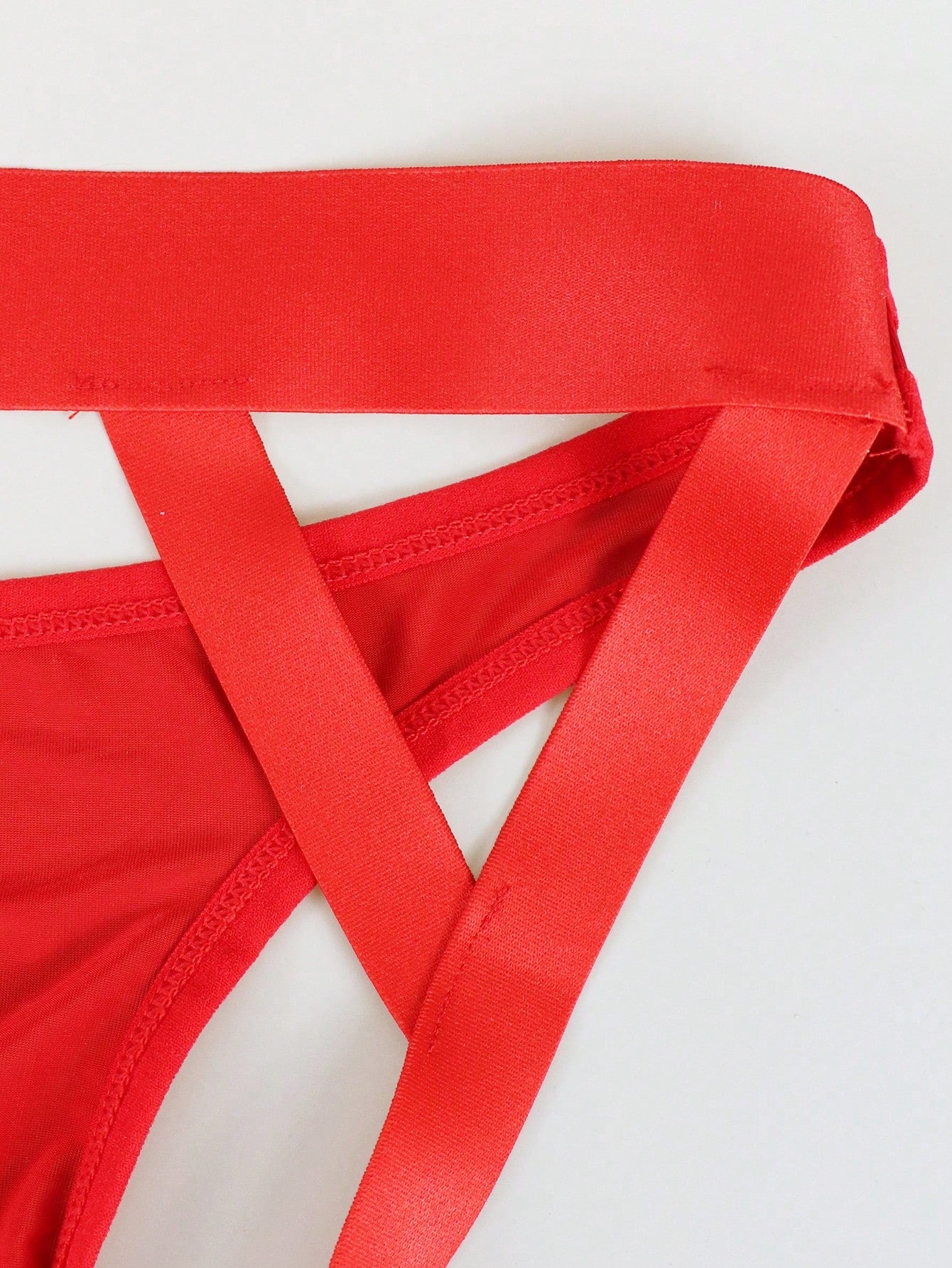 Men's solid color hollow breathable jockstrap underwear with a low-rise brief-style front and minimalist design