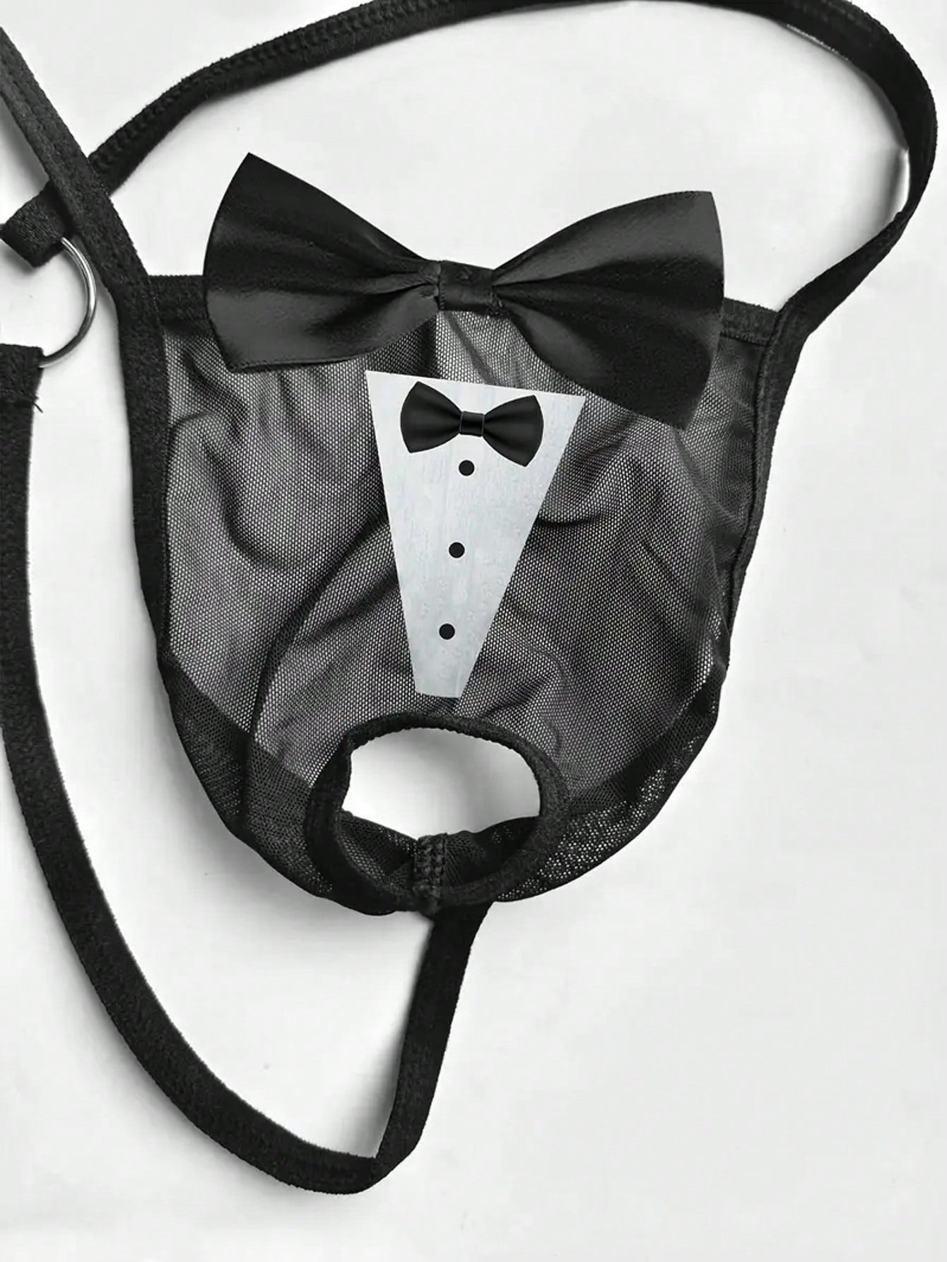 Men's black sheer mesh thong underwear with Halloween bow print pattern, bow decor, and cut-out details