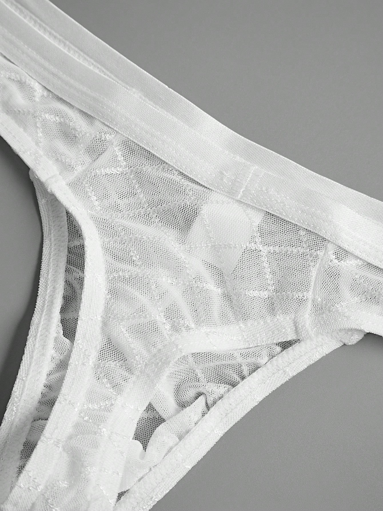 Men's sheer mesh low-rise thong underwear in multicolor plaid and random print fabric