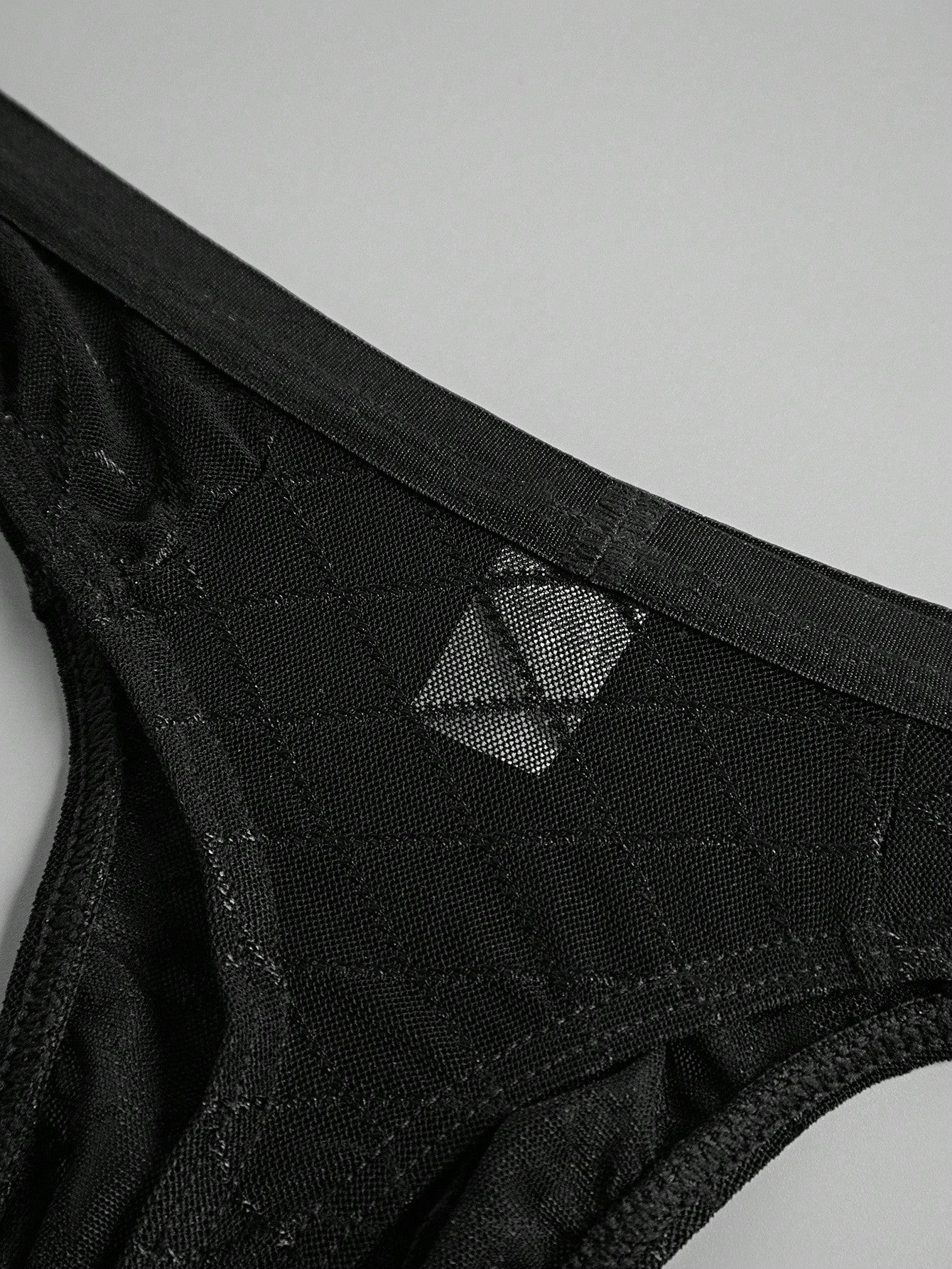 Men's sheer mesh low-rise thong underwear in multicolor plaid and random print fabric