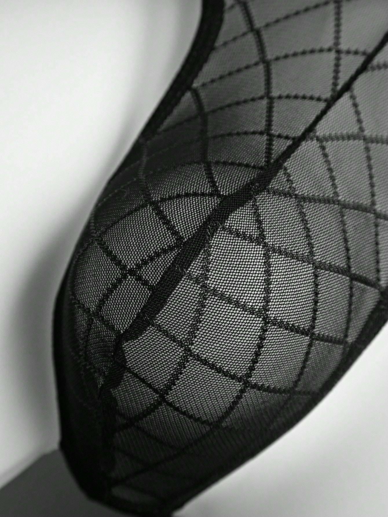 Men's sheer mesh low-rise thong underwear in multicolor plaid and random print fabric