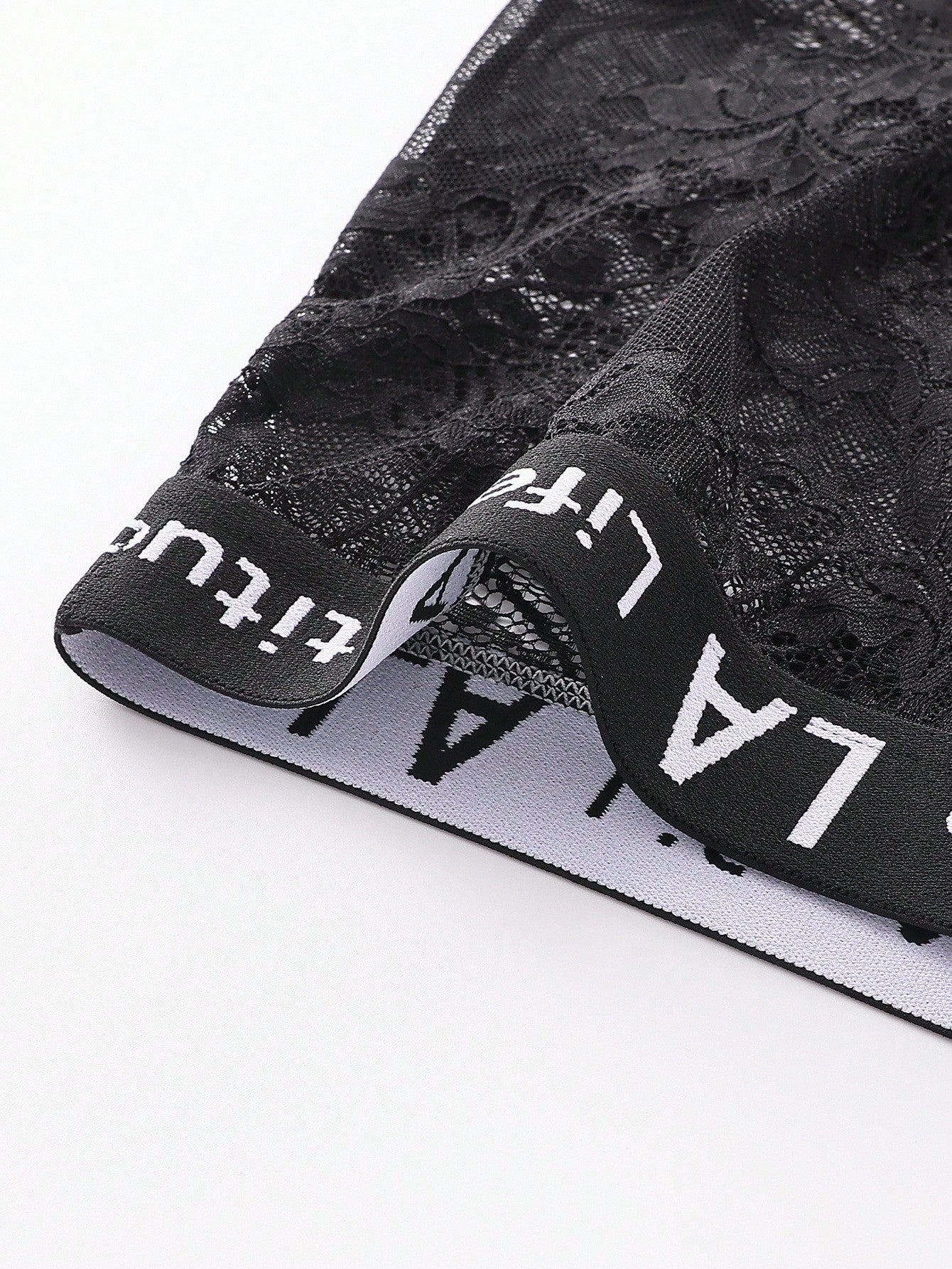 Men's black semi-sheer lace low-rise boxer shorts with a letter waistband and tape detail