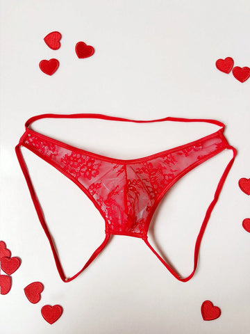 Men's red hollow-out lace jockstrap thong with geometric semi-sheer design, low-rise fit, and backless style