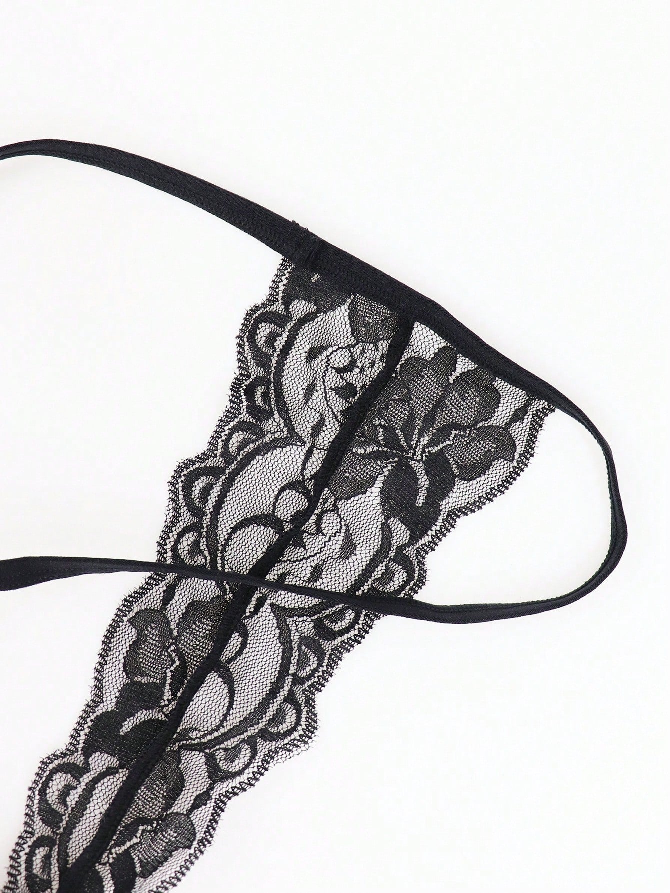 Men's black mesh hollow-out thong underwear with lace trim waist and low-rise brief styling