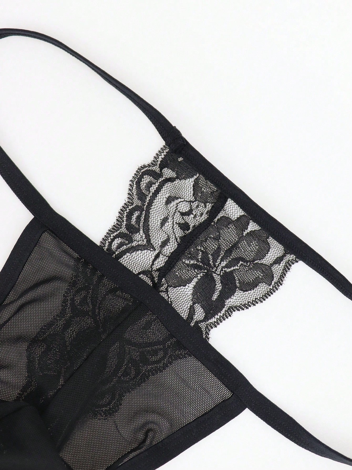Men's black mesh hollow-out thong underwear with lace trim waist and low-rise brief styling