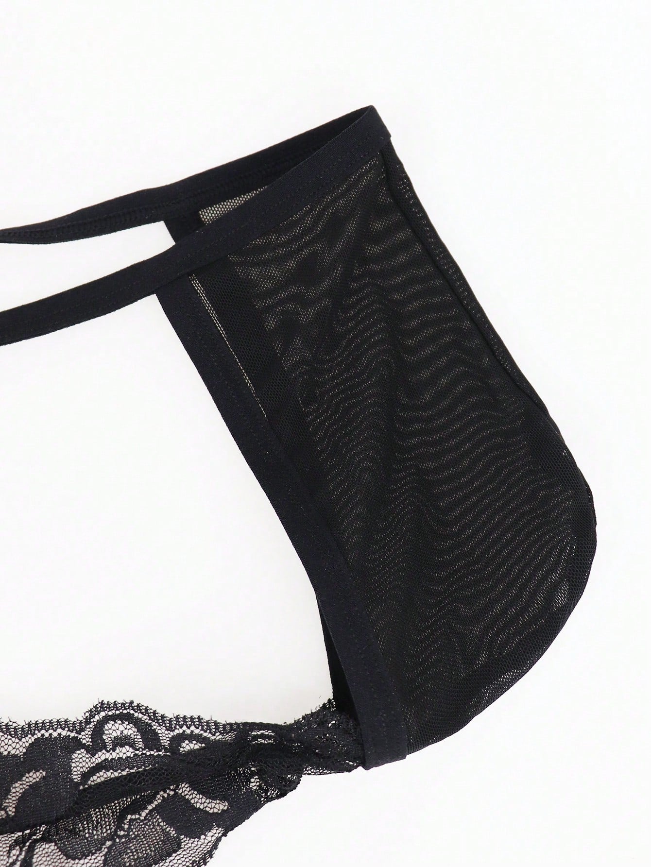 Men's black mesh hollow-out thong underwear with lace trim waist and low-rise brief styling