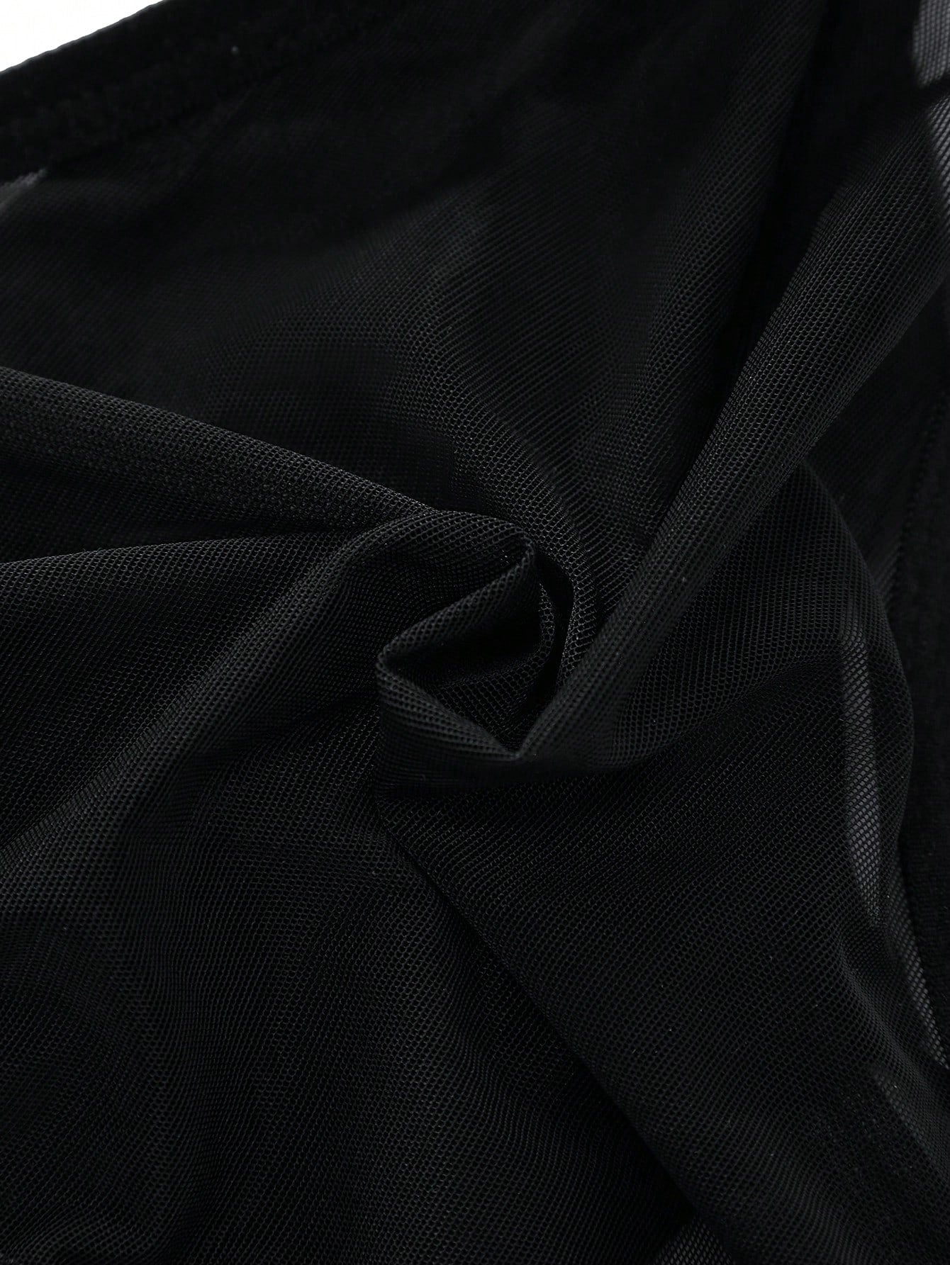 Men's black low-rise briefs with bow tie and pearl decor, colorblock styling, semi-sheer unlined body, and 3D pouch design.