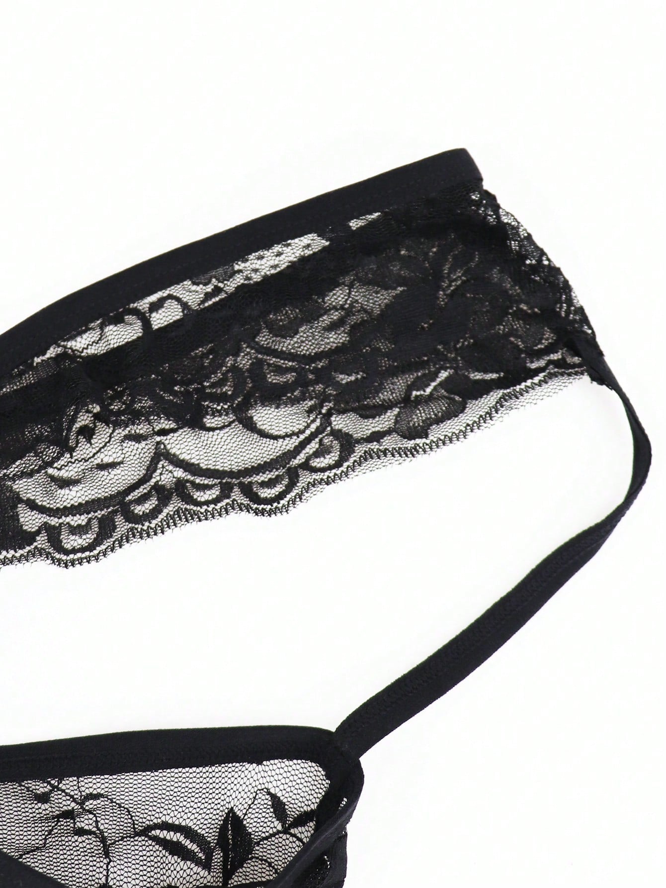 Men's low-rise mesh thong underwear with lace trim and a plain, alluring design