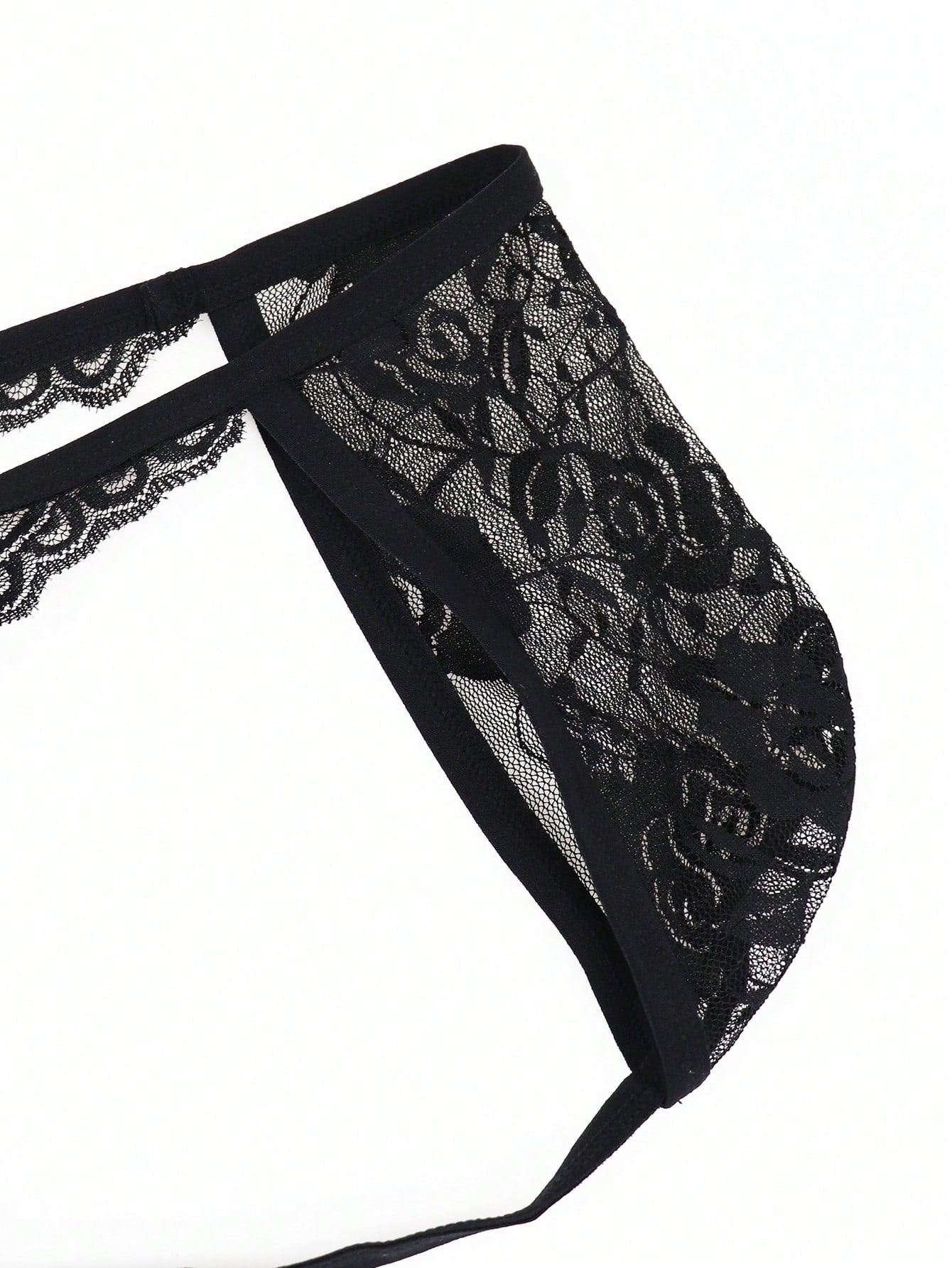 Men's low-rise mesh thong underwear with lace trim and a plain, alluring design