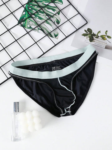 Men's low rise briefs with pouch, backless cut-out design, elastic waist, and contrast binding