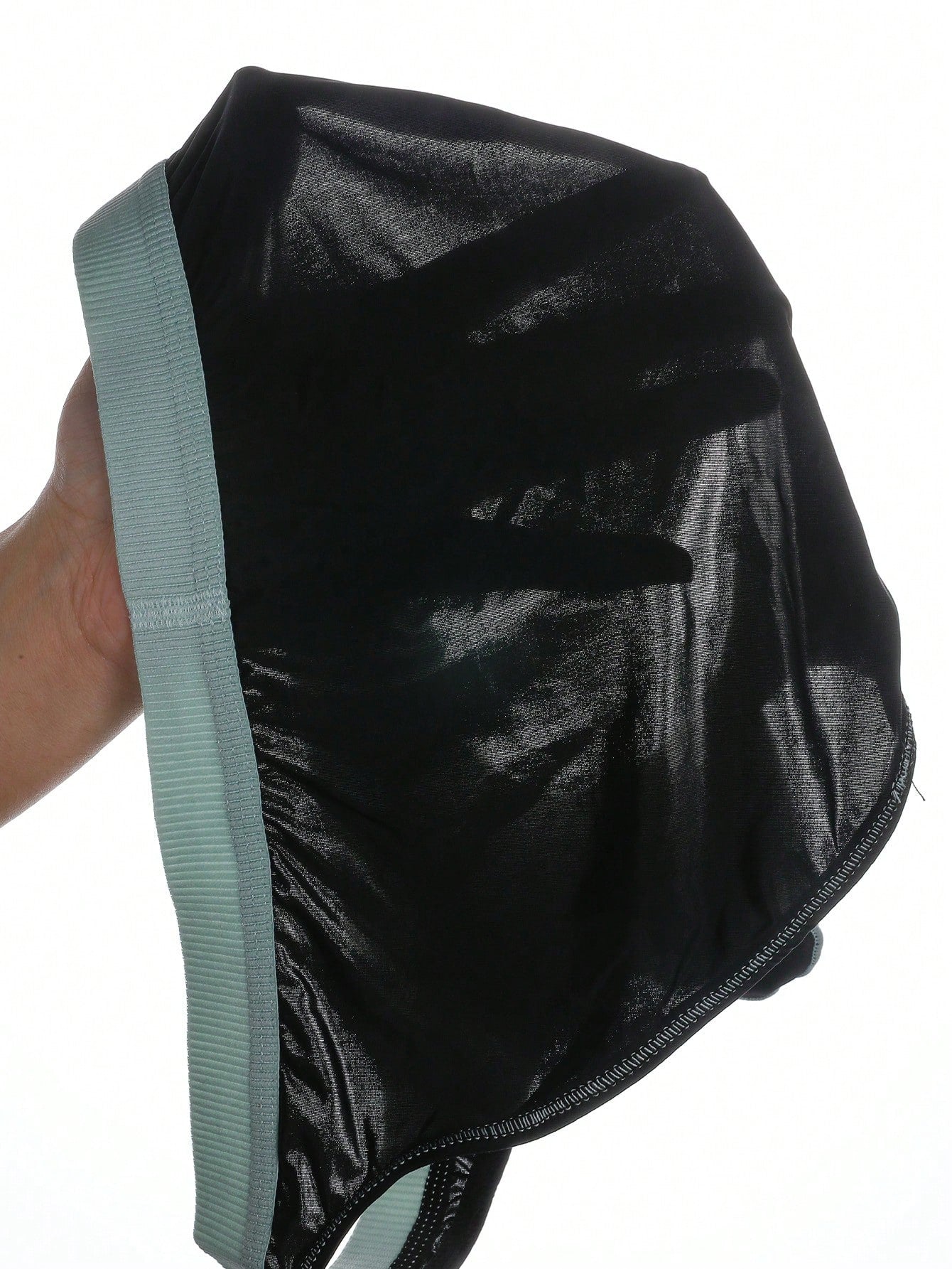 Men's low rise briefs with pouch, backless cut-out design, elastic waist, and contrast binding