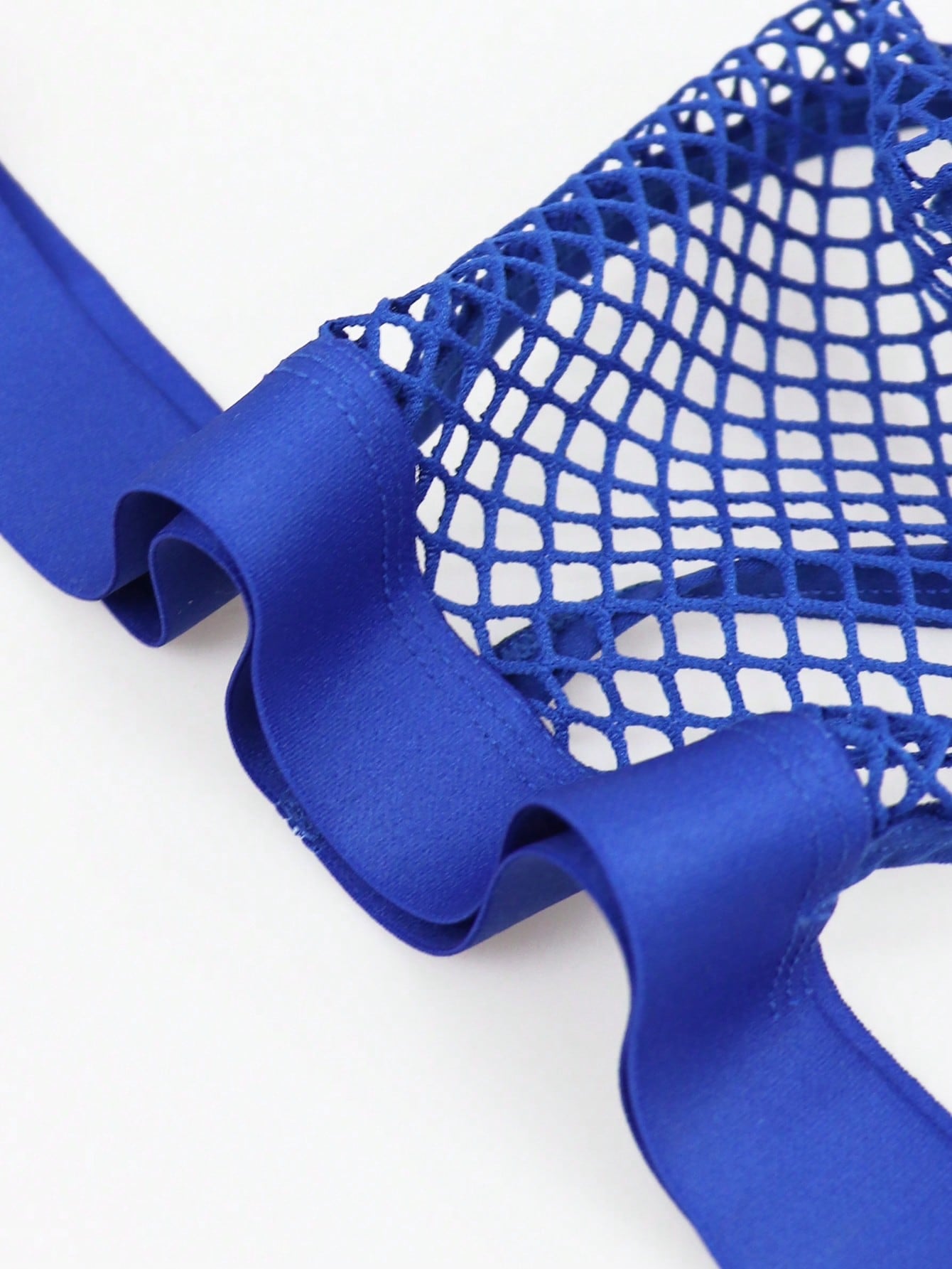 Men's hollow mesh mid-rise thong underwear with a colorblock design