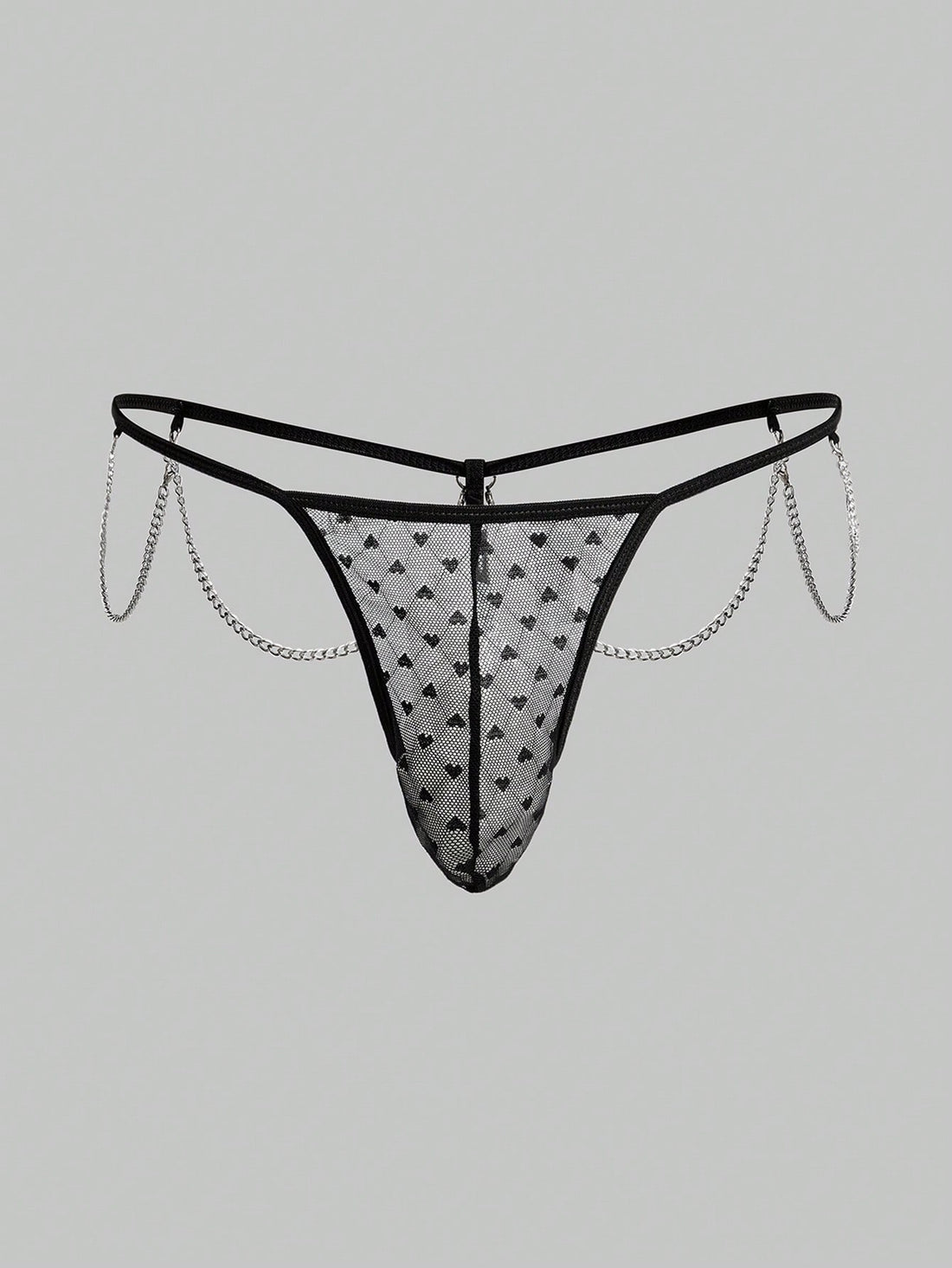 Men's black sheer mesh low-rise thong underwear with heart-shaped hollow-out design, geometric pattern, ring detail, and chain accent