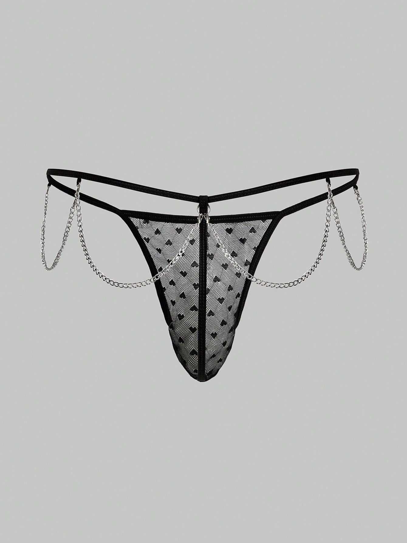 Men's black sheer mesh low-rise thong underwear with heart-shaped hollow-out design, geometric pattern, ring detail, and chain accent