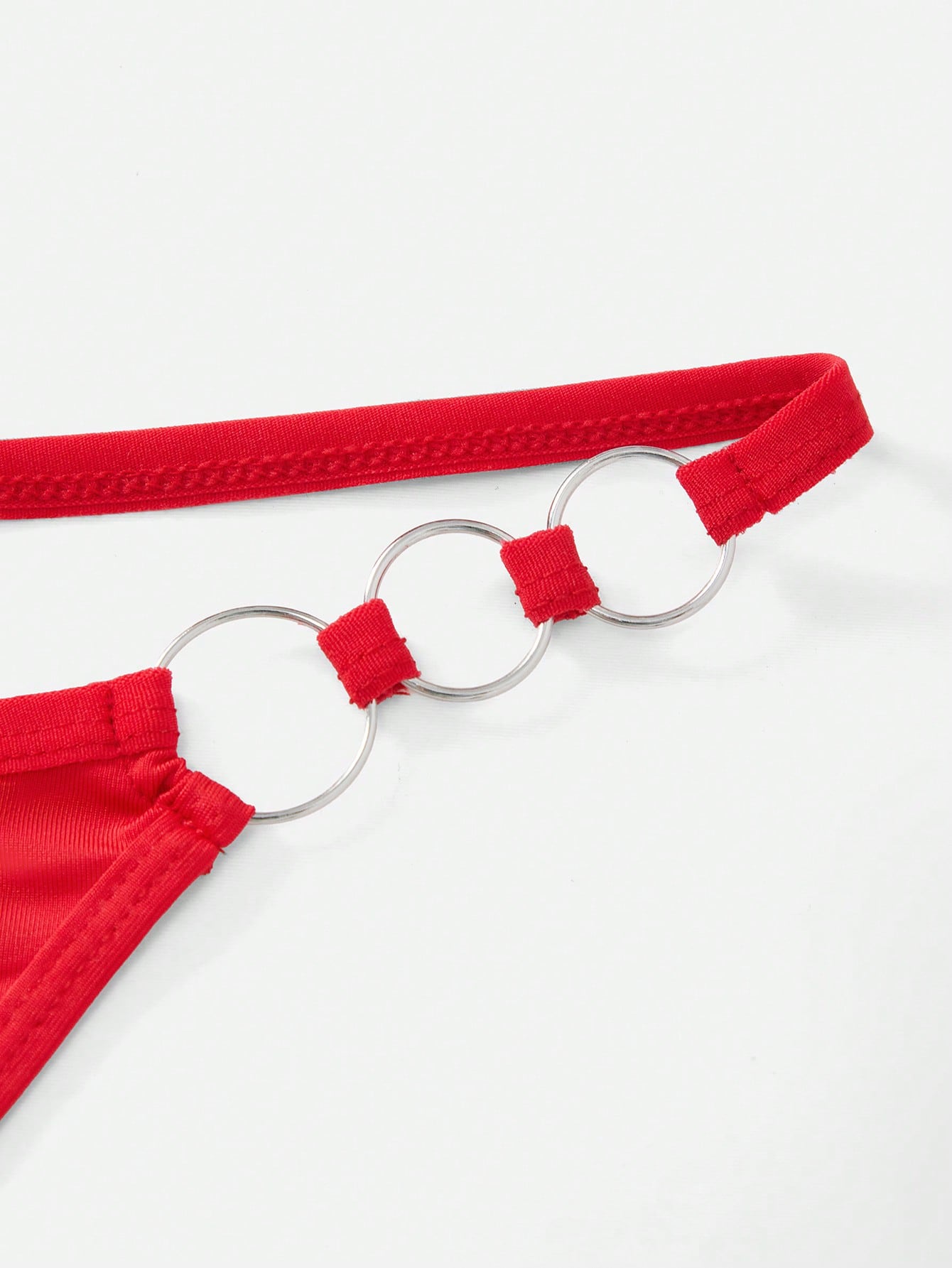 Men's red low-rise thong underwear with metal decor, plain high-stretch knitted fabric, unlined and non-sheer