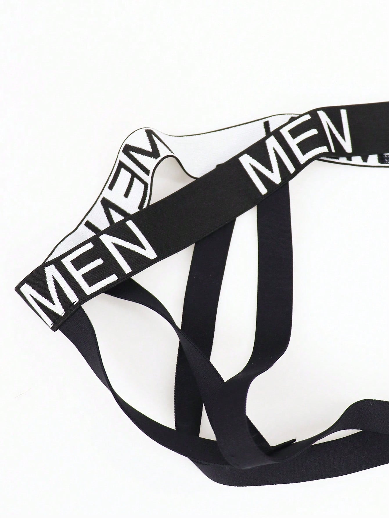 Men's black low-rise jockstrap briefs made from striped mesh fabric with a slim fit design