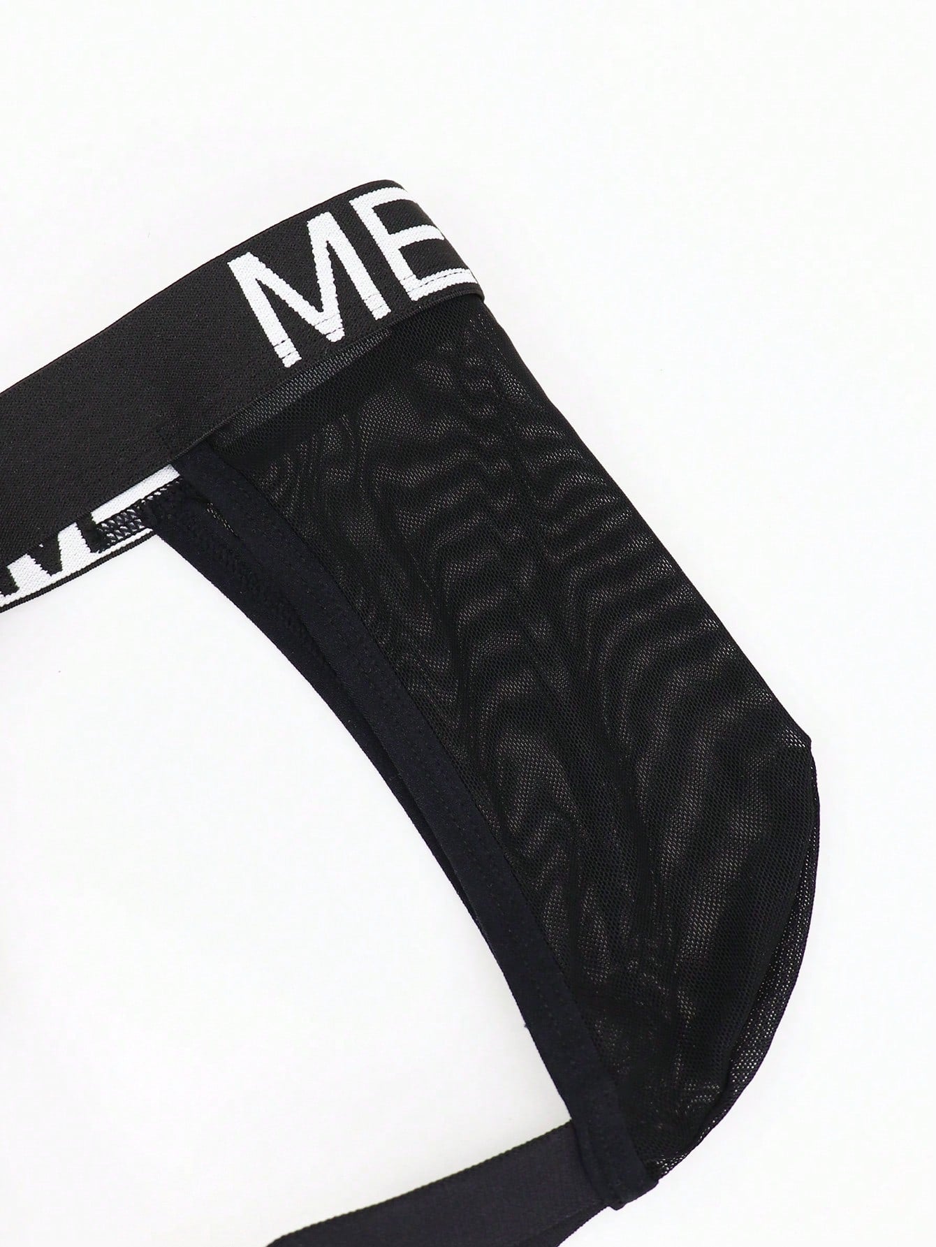 Men's black low-rise jockstrap briefs made from striped mesh fabric with a slim fit design