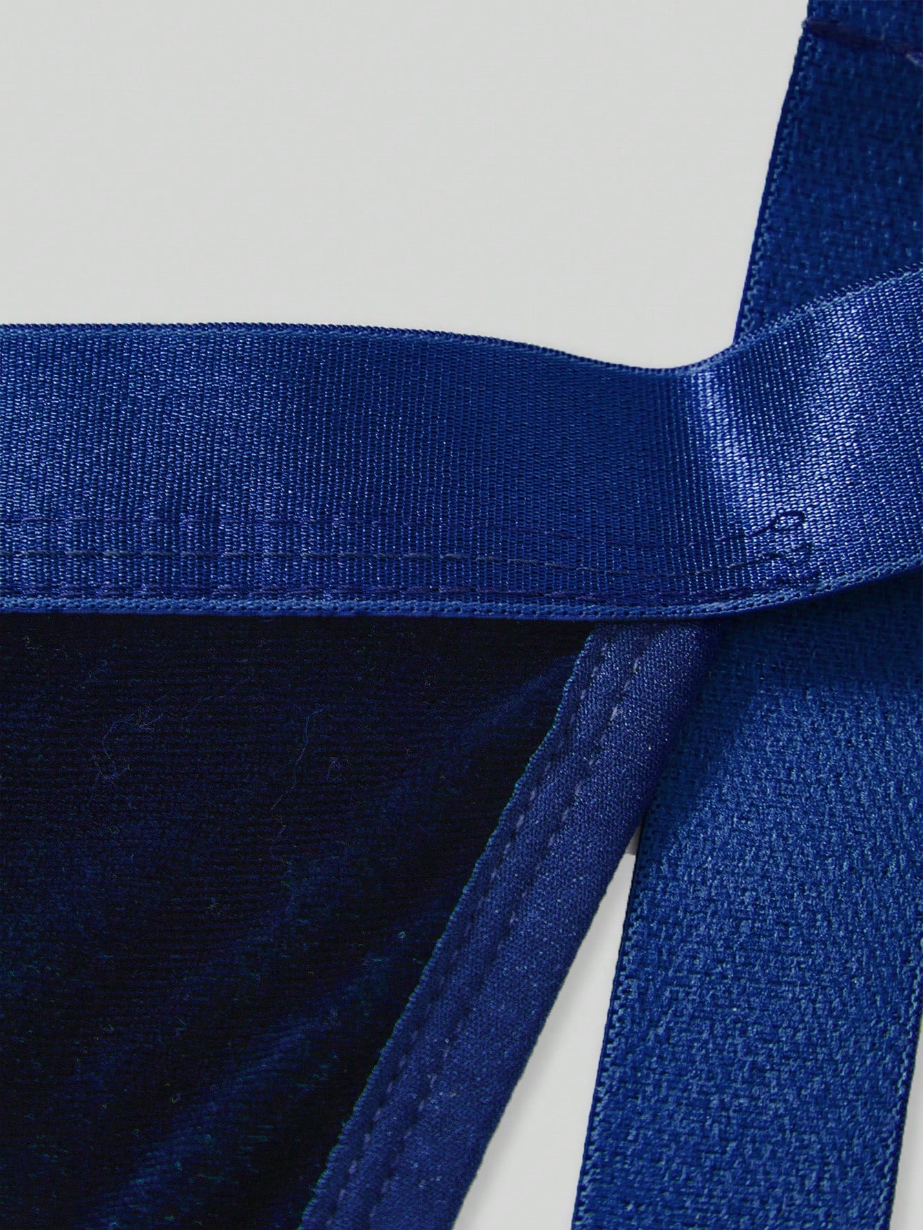 Men's Christmas pom-pom low-rise jockstrap with colorblock styling, designed for party wear
