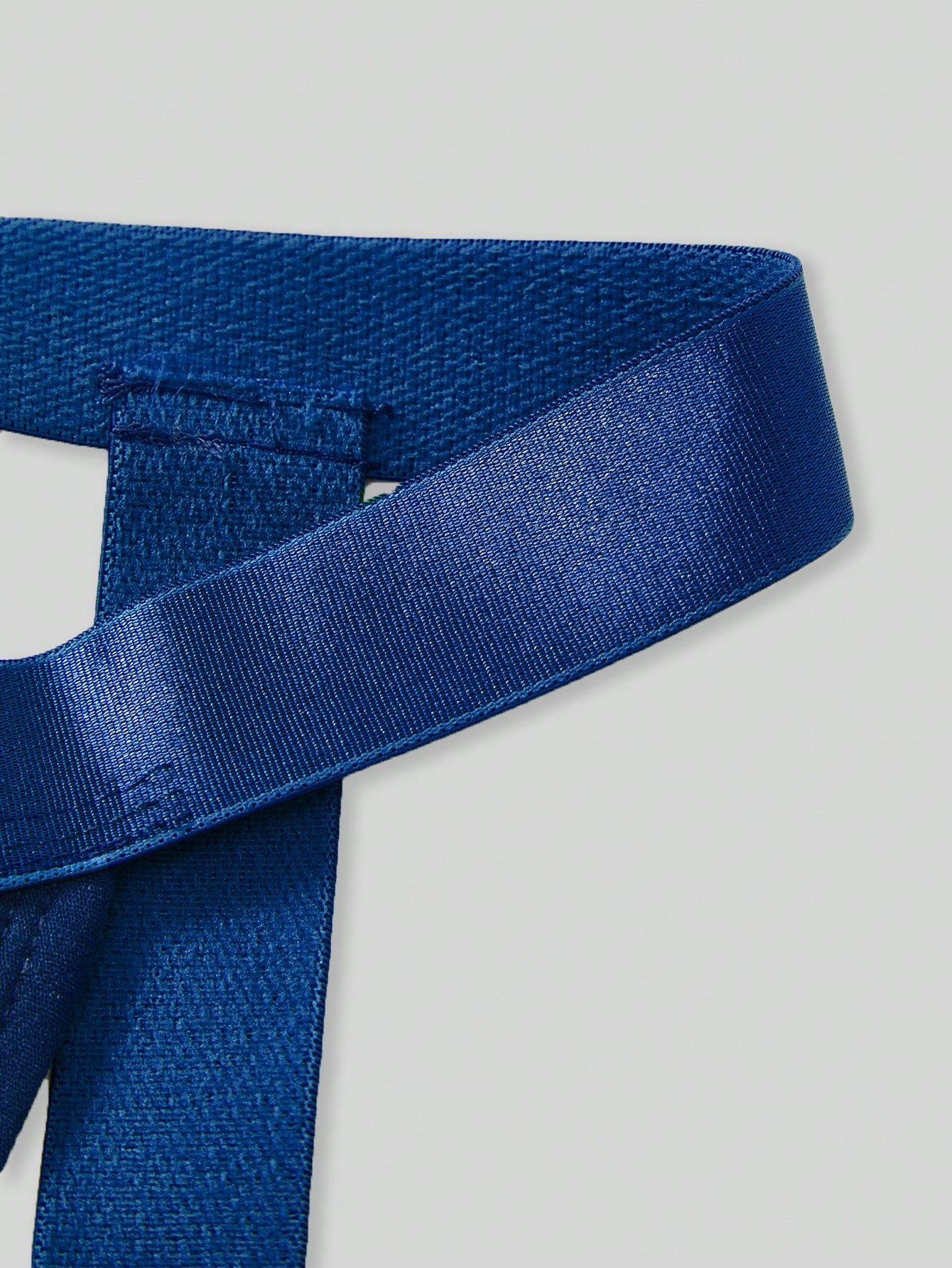 Men's Christmas pom-pom low-rise jockstrap with colorblock styling, designed for party wear
