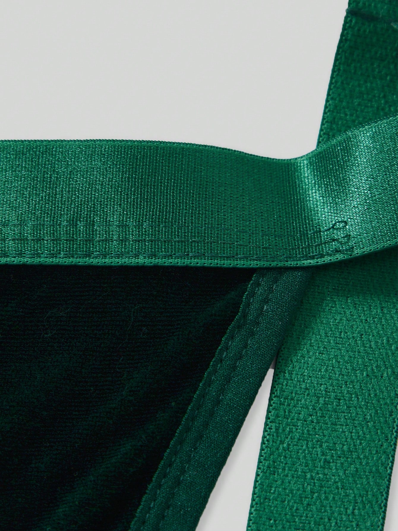 Men's Christmas pom-pom low-rise jockstrap with colorblock styling, designed for party wear