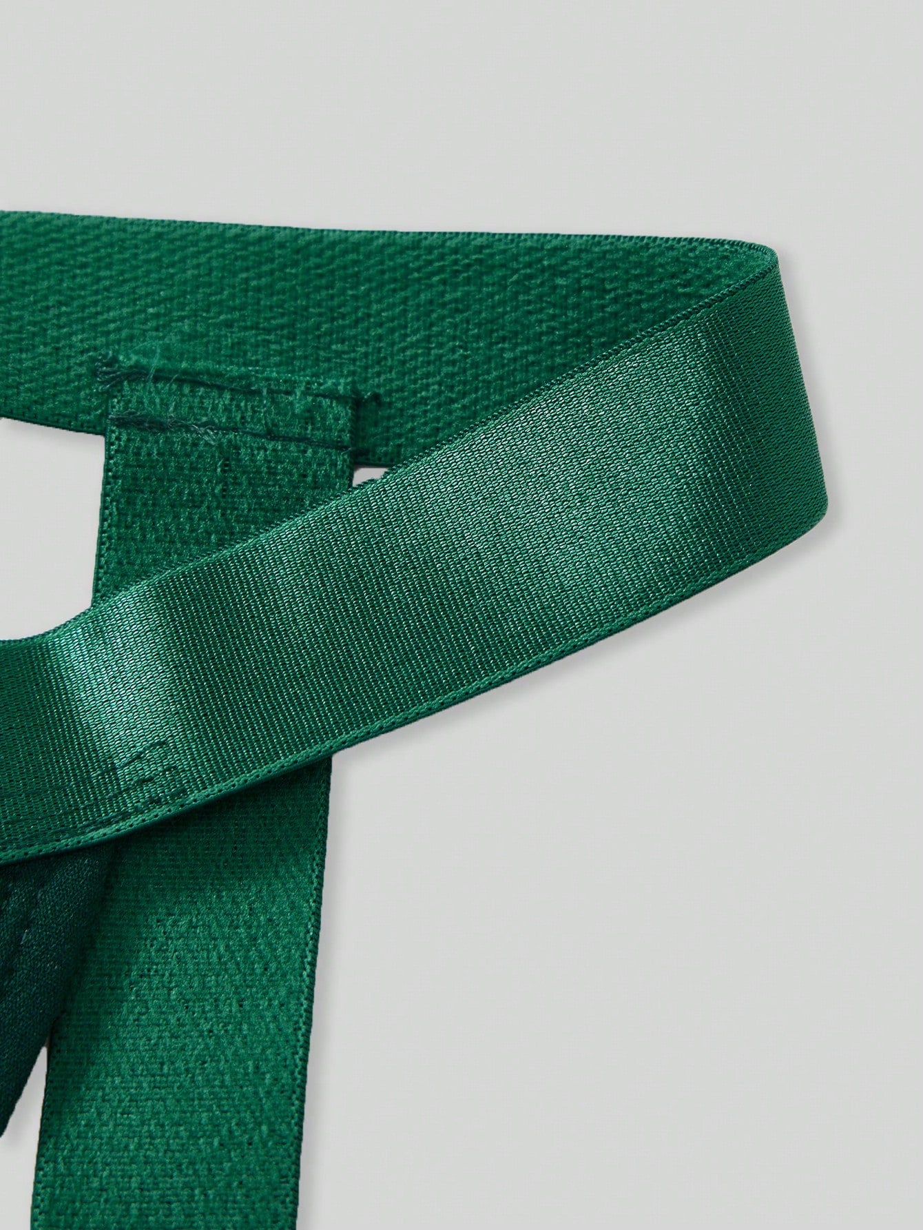 Men's Christmas pom-pom low-rise jockstrap with colorblock styling, designed for party wear