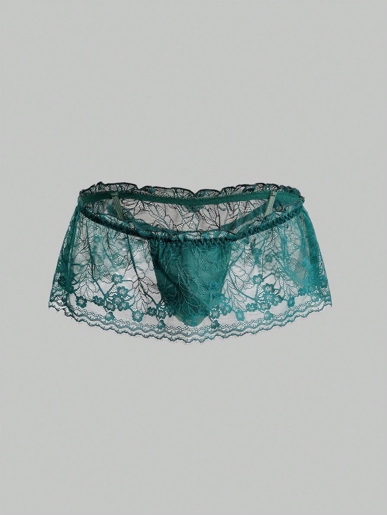 Men's dark green low-rise thong underwear with contrast lace, semi-sheer detailing, and random print design.
