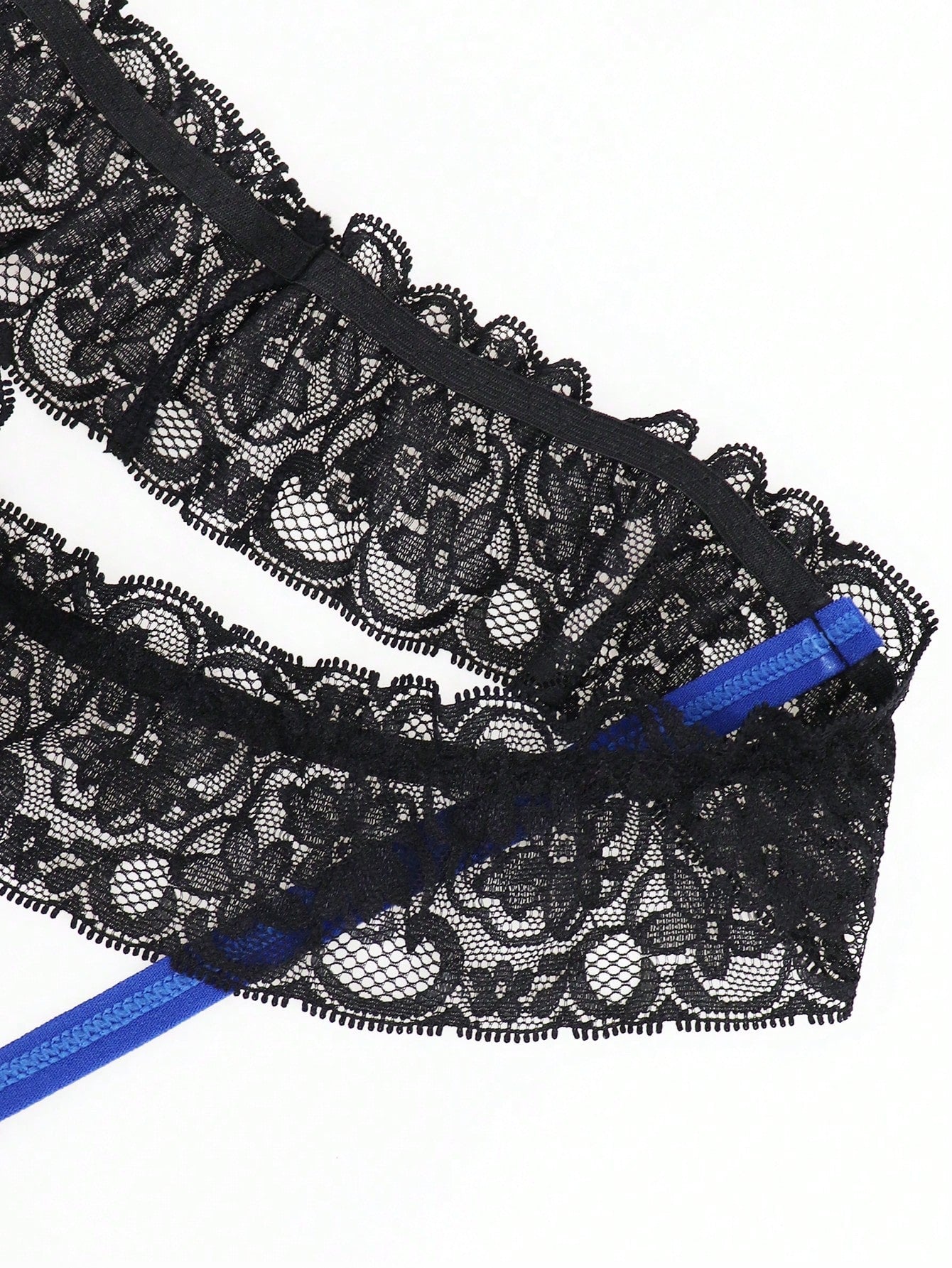 Men's black low-rise jockstrap thong with vibrant blue trim, lace-trim waistband, and plant pattern details