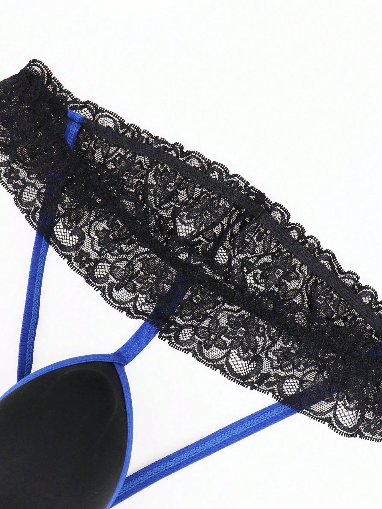 Men's black low-rise jockstrap thong with vibrant blue trim, lace-trim waistband, and plant pattern details