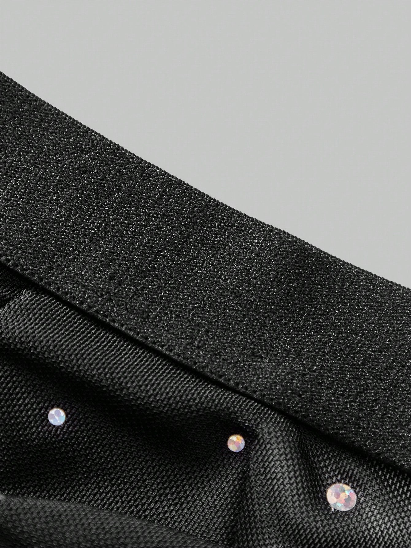 Men's black low rise party lingerie briefs with backless design and plain high-stretch knitted fabric