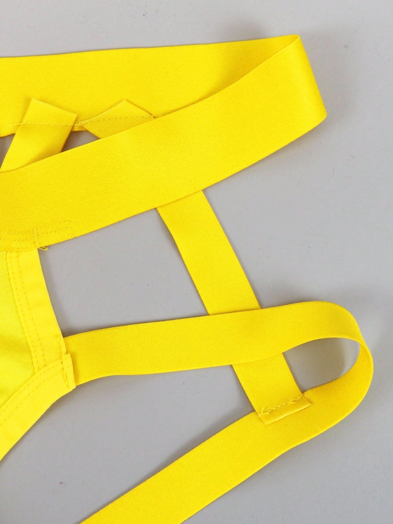Men's low rise jockstrap underwear with cut out detail and colorblock design in medium-stretch knitted fabric