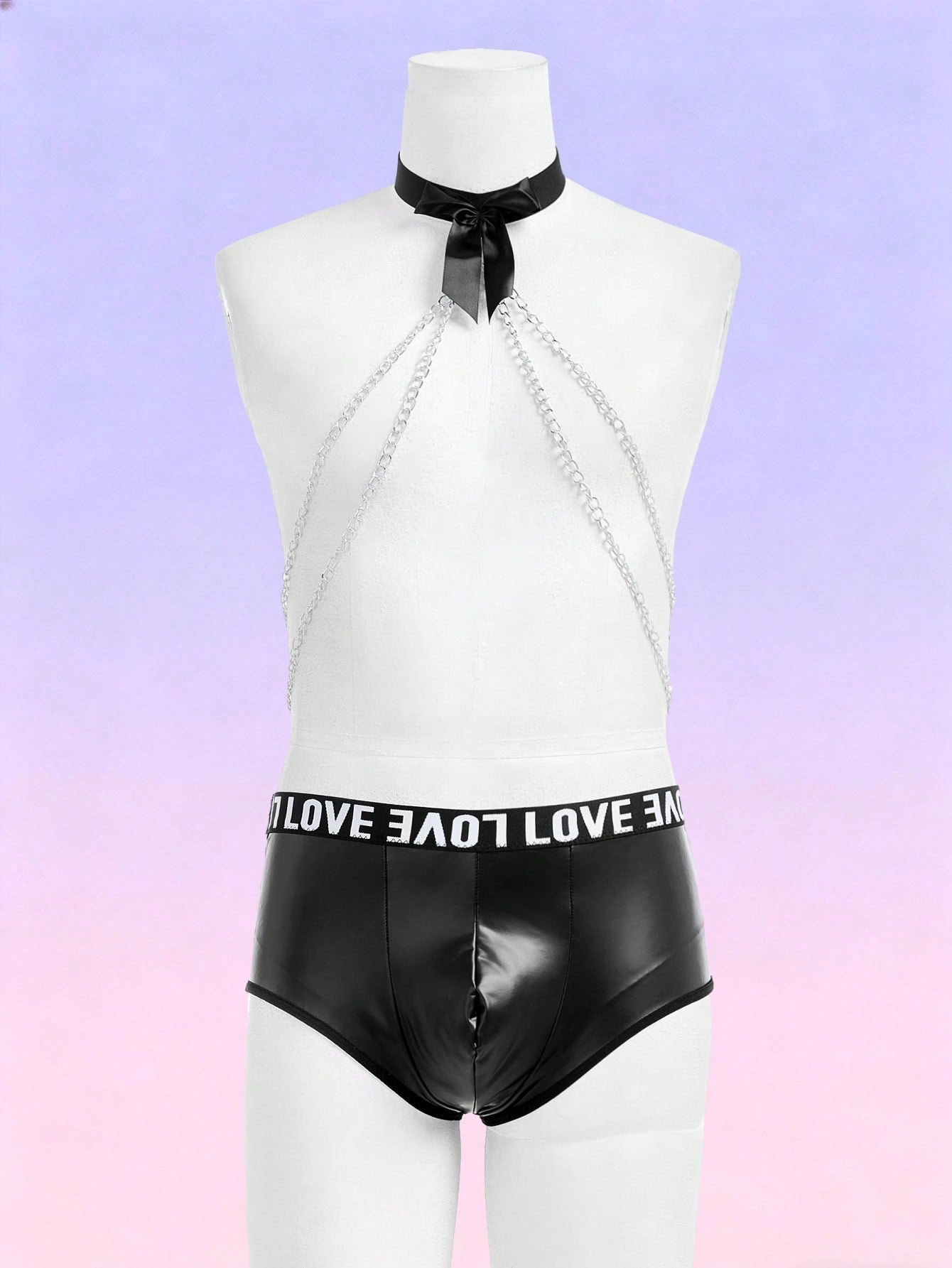 Black men's mid-rise briefs with letter woven strap, backless knot and tape details, and chain necklace