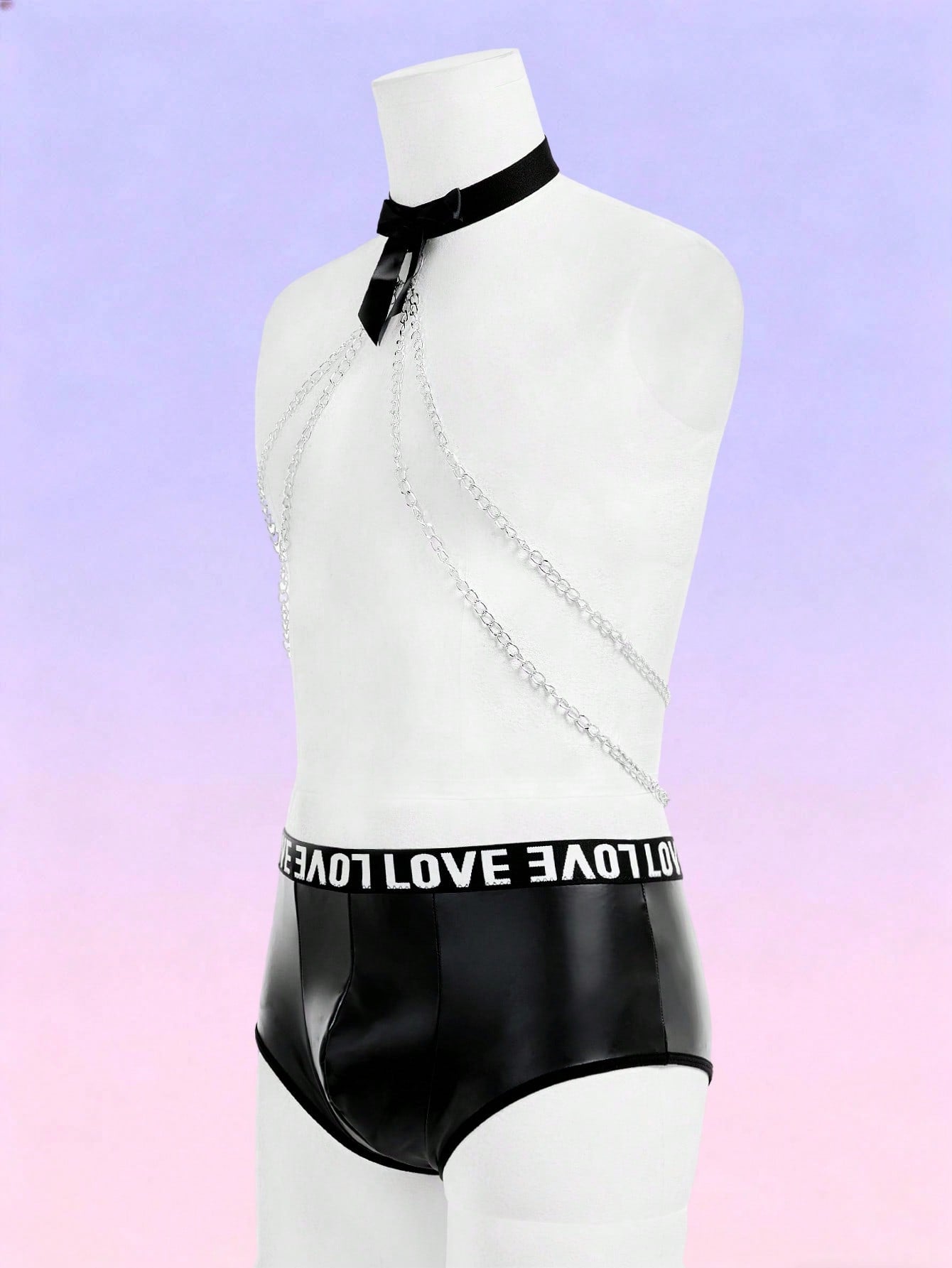 Black men's mid-rise briefs with letter woven strap, backless knot and tape details, and chain necklace