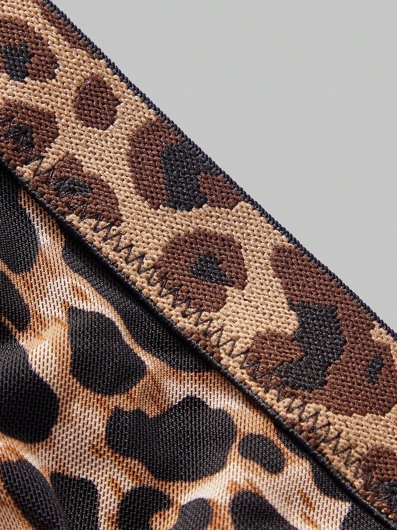 Men's leopard print mesh lingerie set with short vest, leopard tape details, knot accent, and low-rise thong.