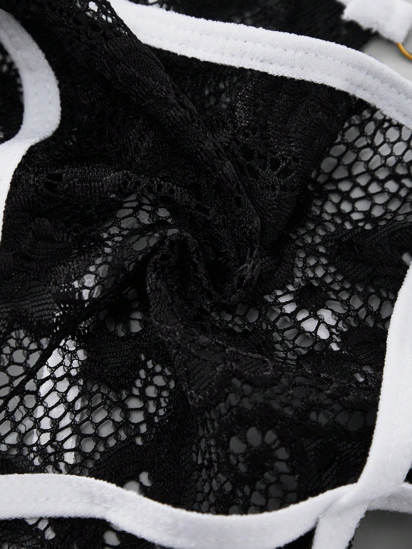 Men's black lace thong underwear with sheer details and bowknot ribbon accent, low-rise semi-sheer design