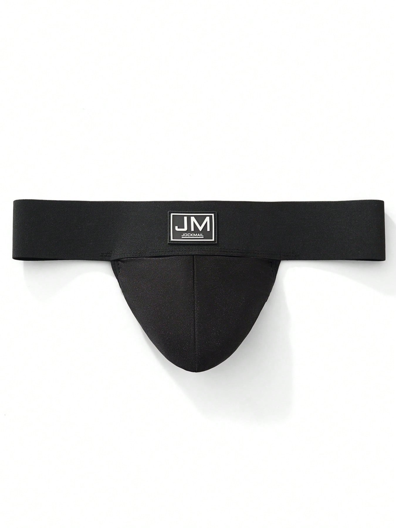 Men's black low-rise thong underwear with wide waistband and letter pattern, made from medium-stretch fabric.