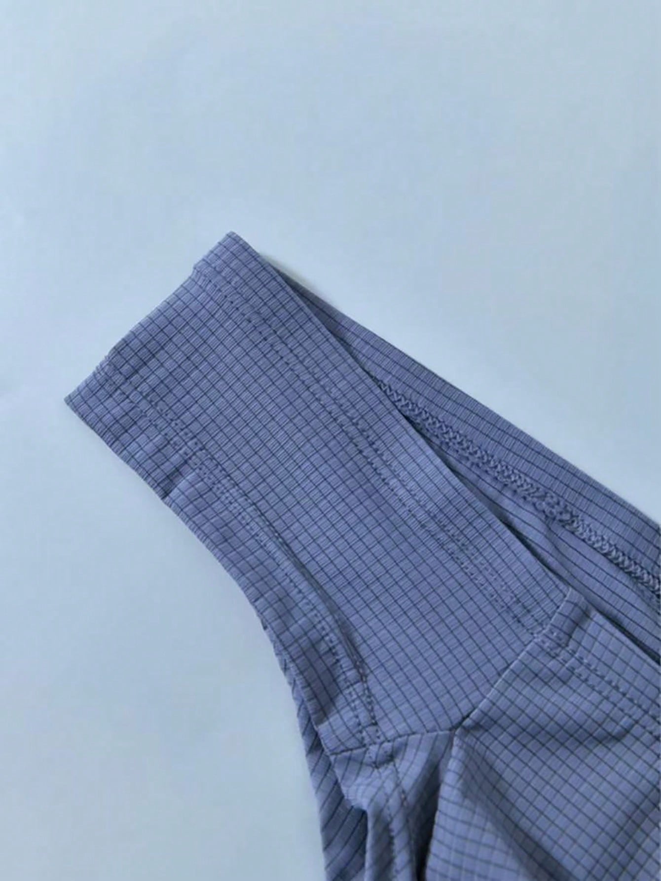 Men's low rise T-back thong briefs in a plain design with revealing back coverage
