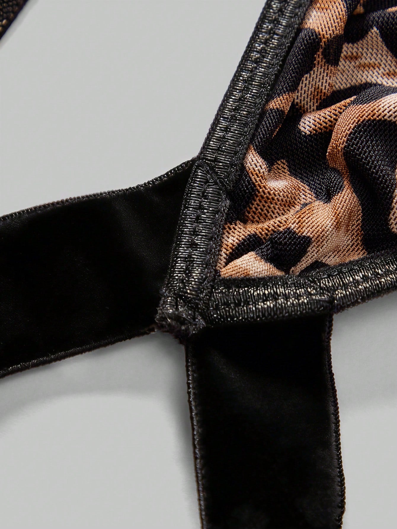 Men's leopard print mesh lingerie set with short vest, leopard tape details, knot accent, and low-rise thong.